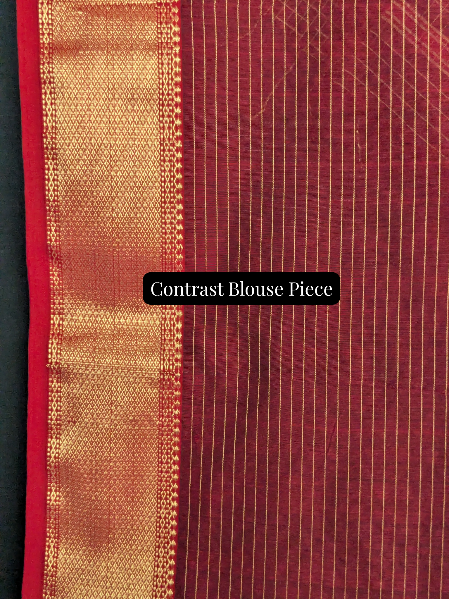 Contrast red blouse piece included to beautifully complement the black saree body.