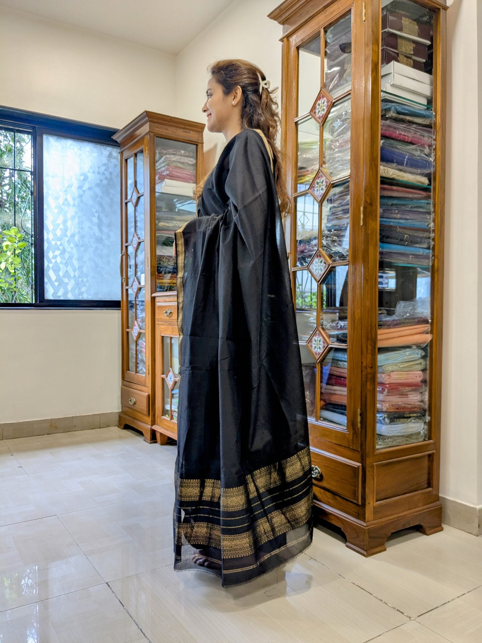 Side view of lightweight handwoven saree showing elegant drape and textured check weave.