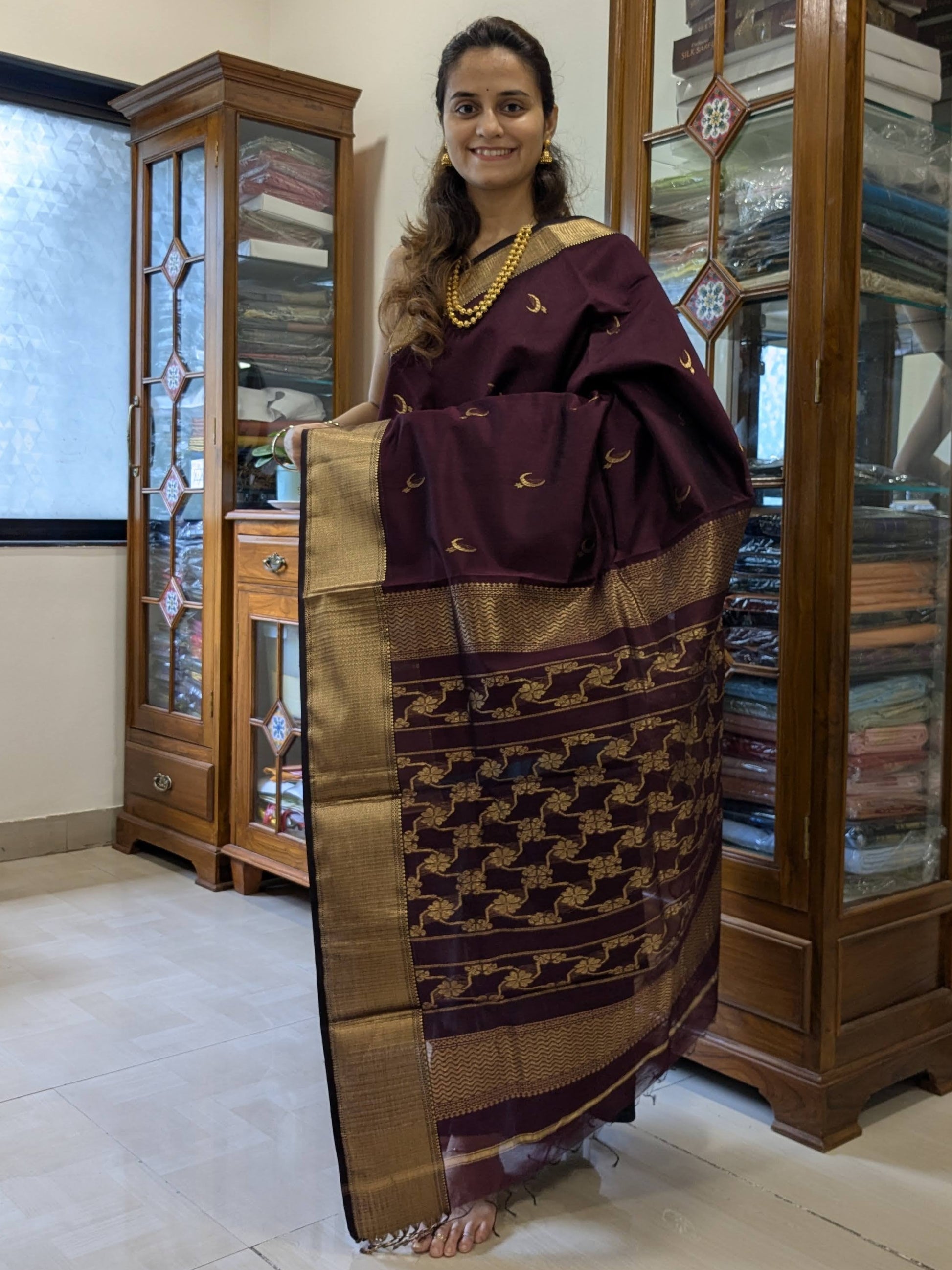 Full view displaying the festive silk-cotton weave and elegant fall.