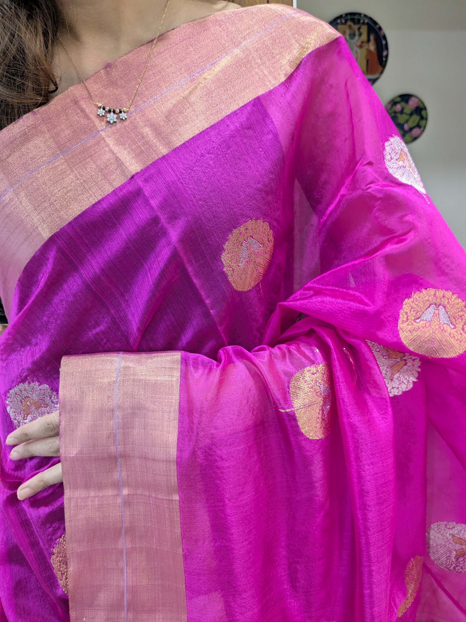 Close-up of hot pink Chanderi silk saree with bird motifs, handloom weave, and medium border.