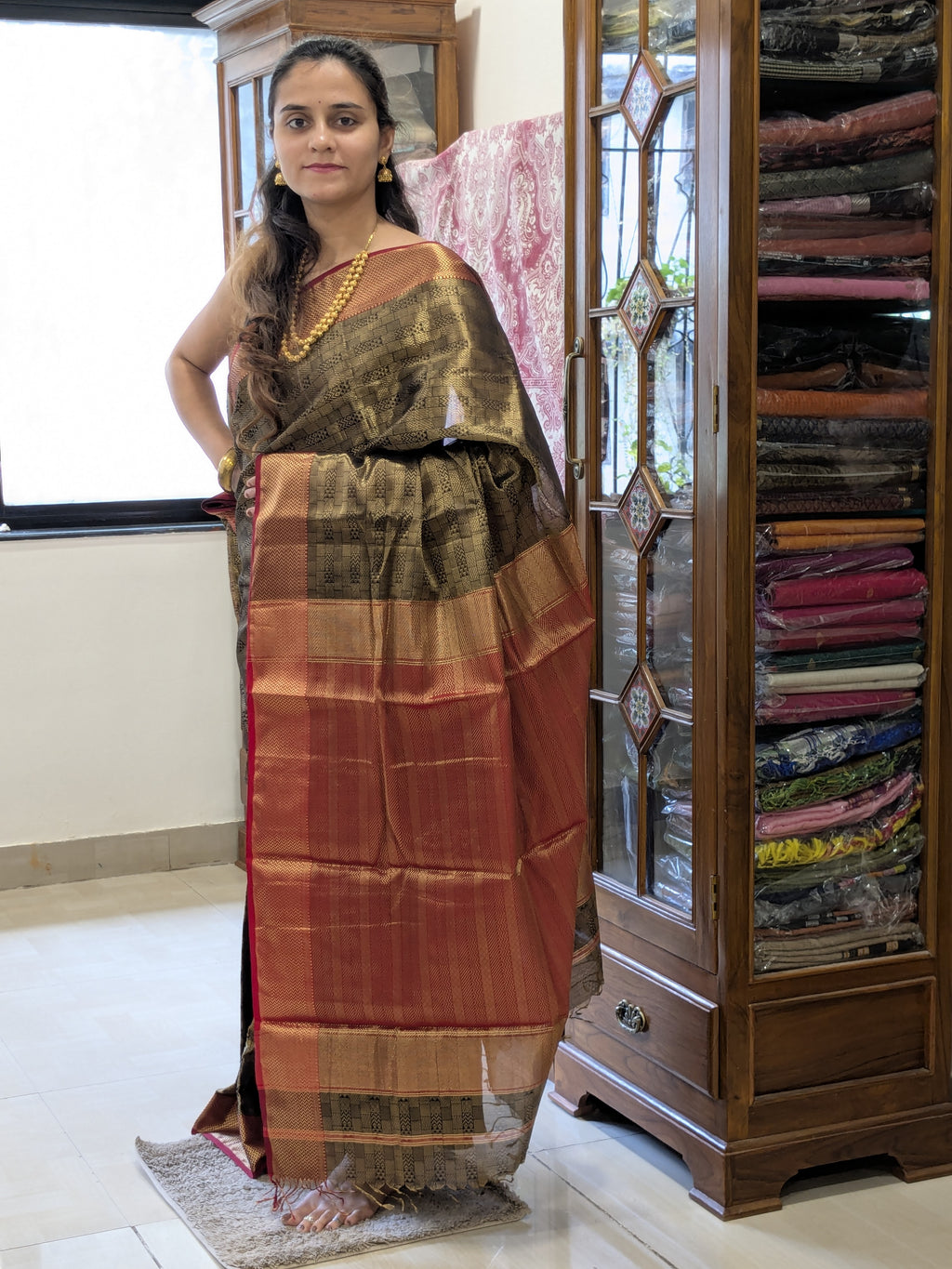 Maheshwari Handloom Black and Gold Tissue Saree with Red Pallu