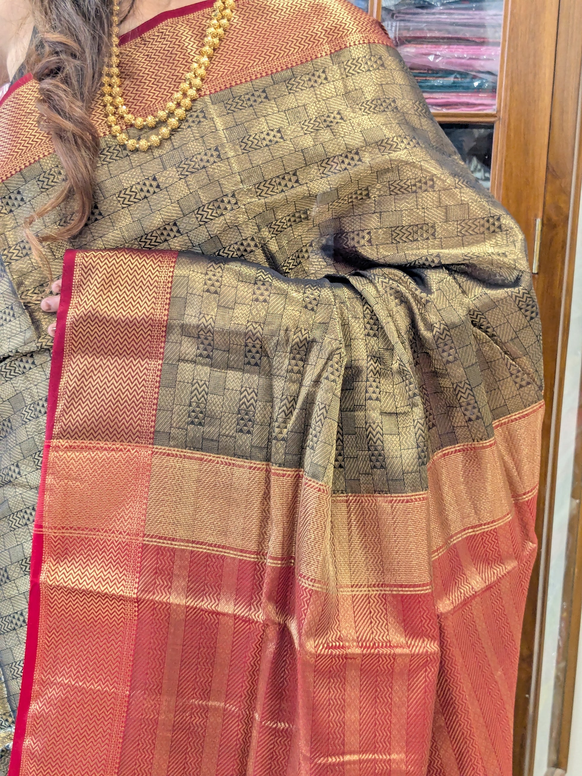 Maheshwari Handloom Black and Gold Tissue Saree with Red Pallu