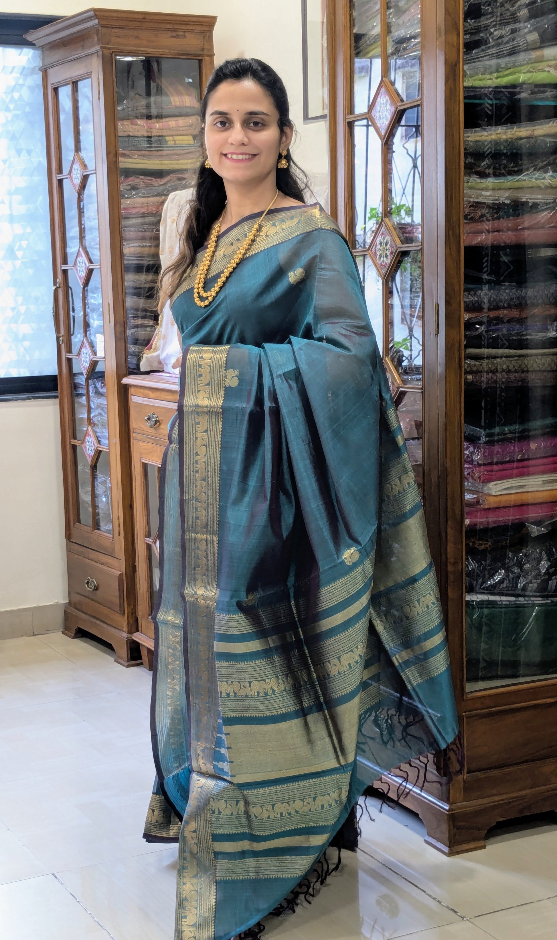 Bluish Green Kanjeevaram Silk Cotton Saree with Mor Buttis & Zari Pallu
