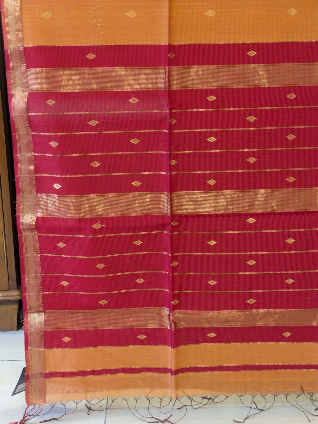 Orange Maheshwari Silk Cotton Saree with Red Buttidar Pallu