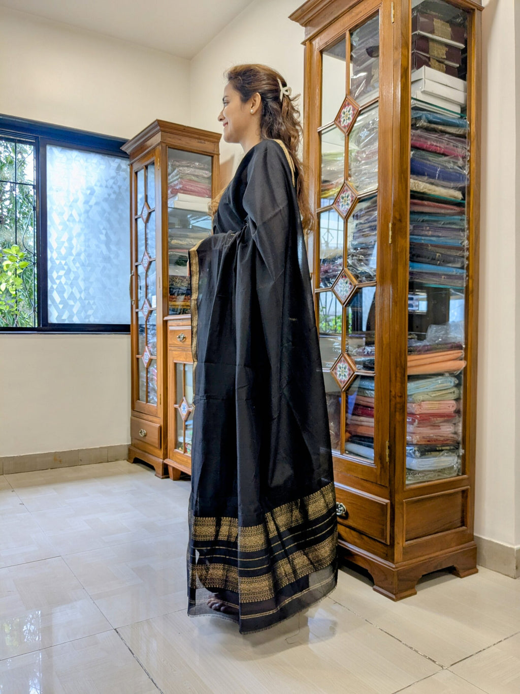 Side view of lightweight handwoven saree showing elegant drape and textured check weave. 