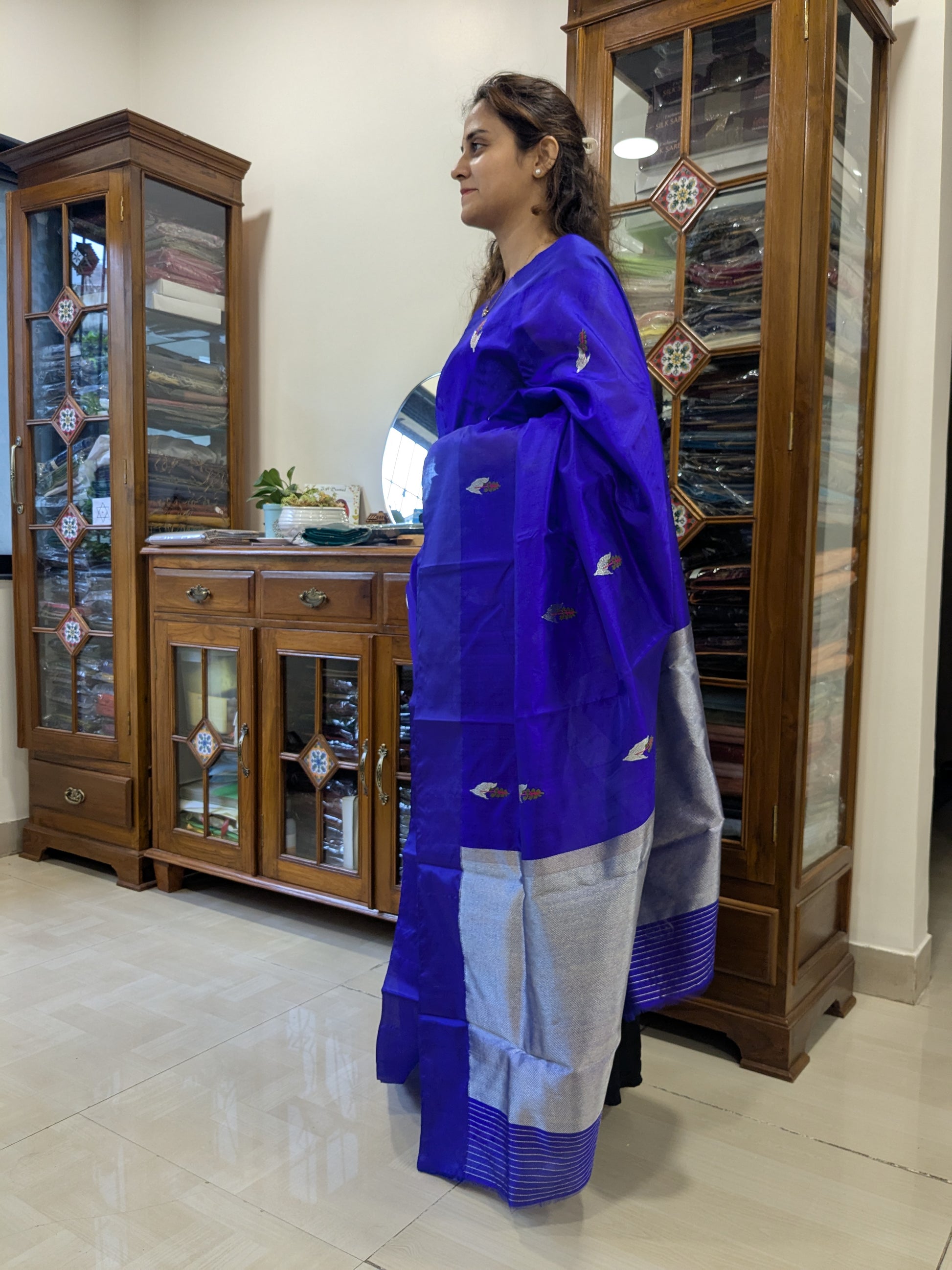 Side view of violet Chanderi saree showcasing soft drape, sheer silk finish, and intricate handwoven detailing.