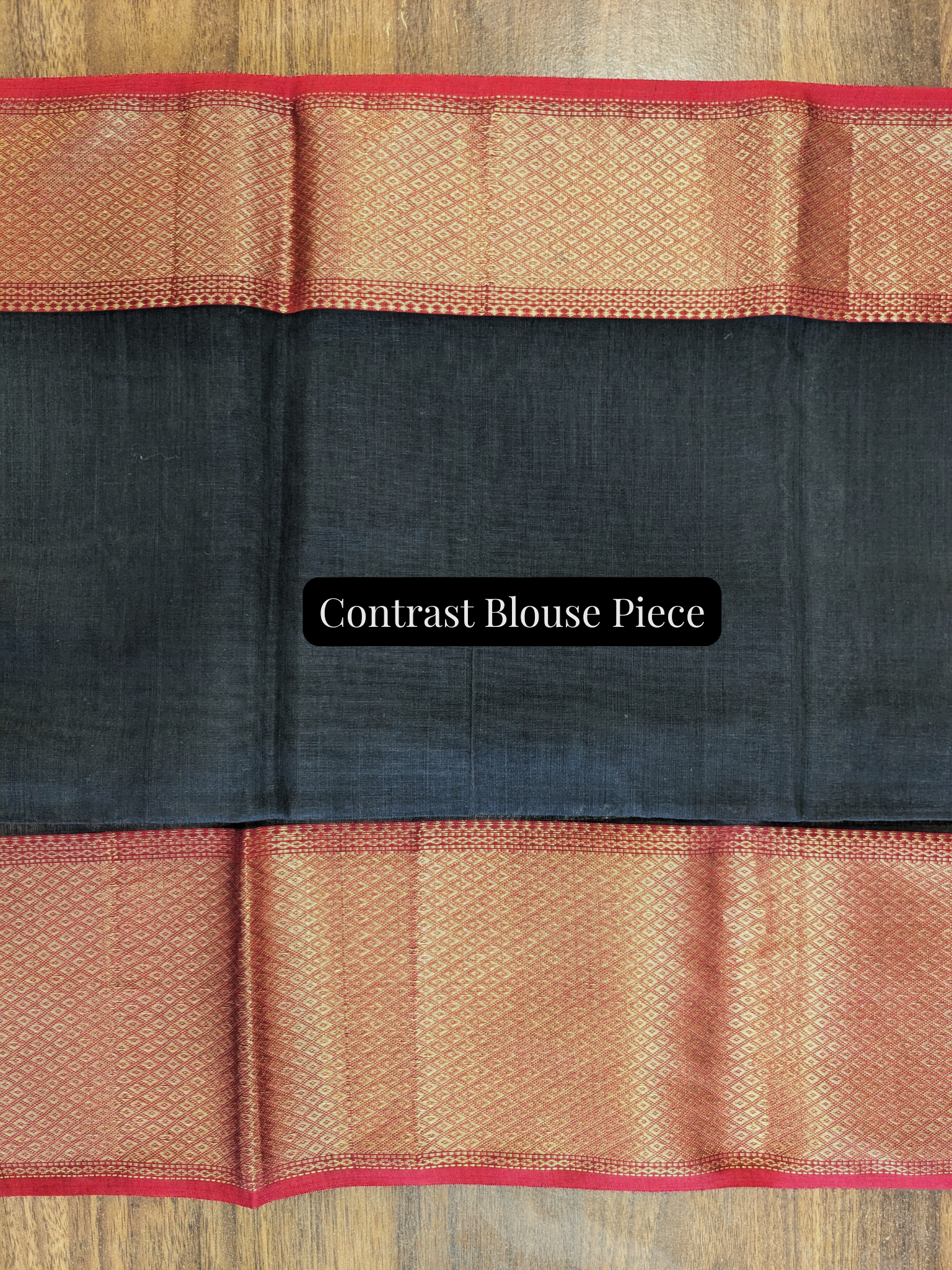 Black contrast blouse piece included to enhance the festive appeal of the green Maheshwari saree.