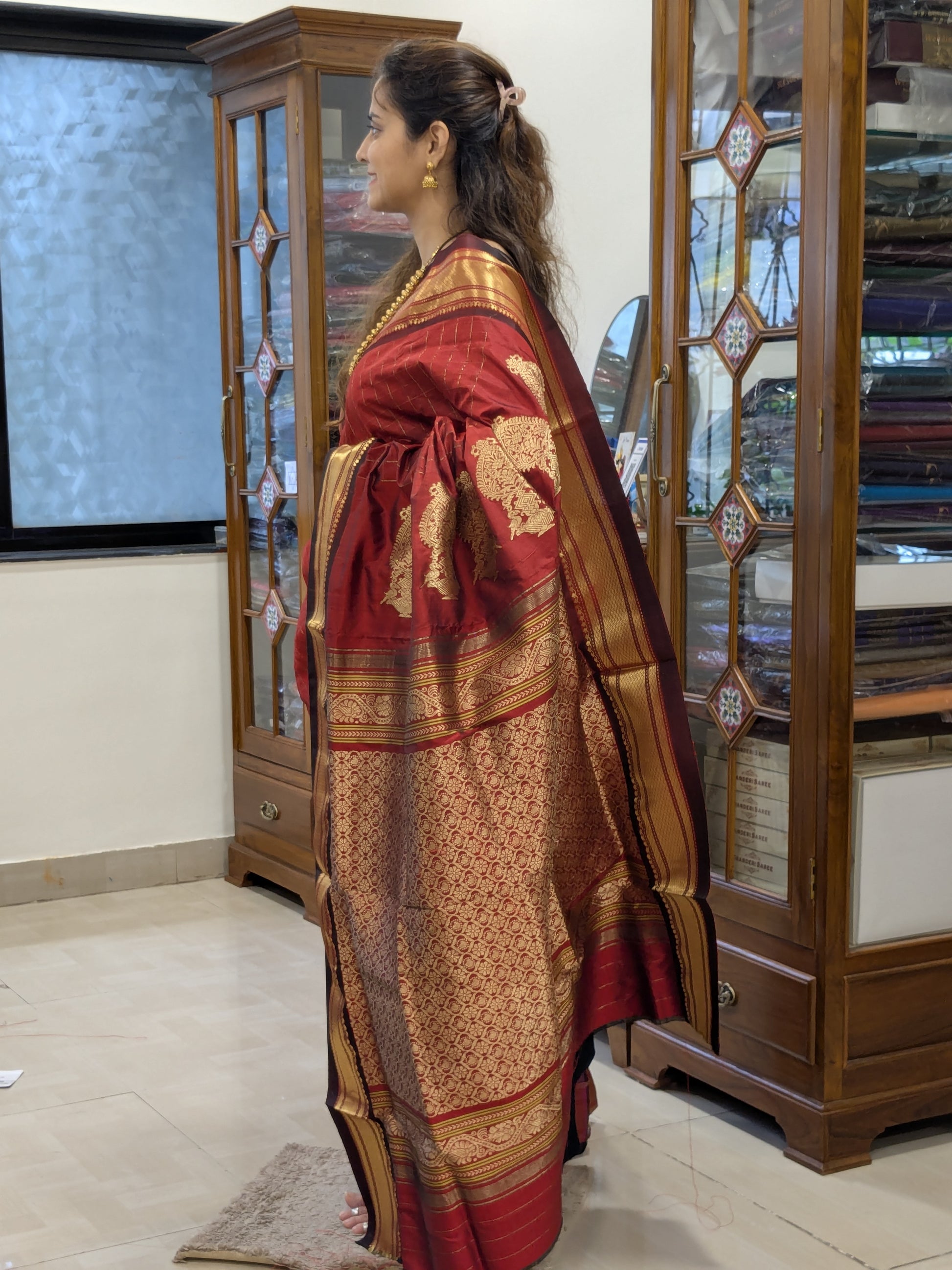 Side view capturing fluid drape and festive elegance of handwoven zari checks.