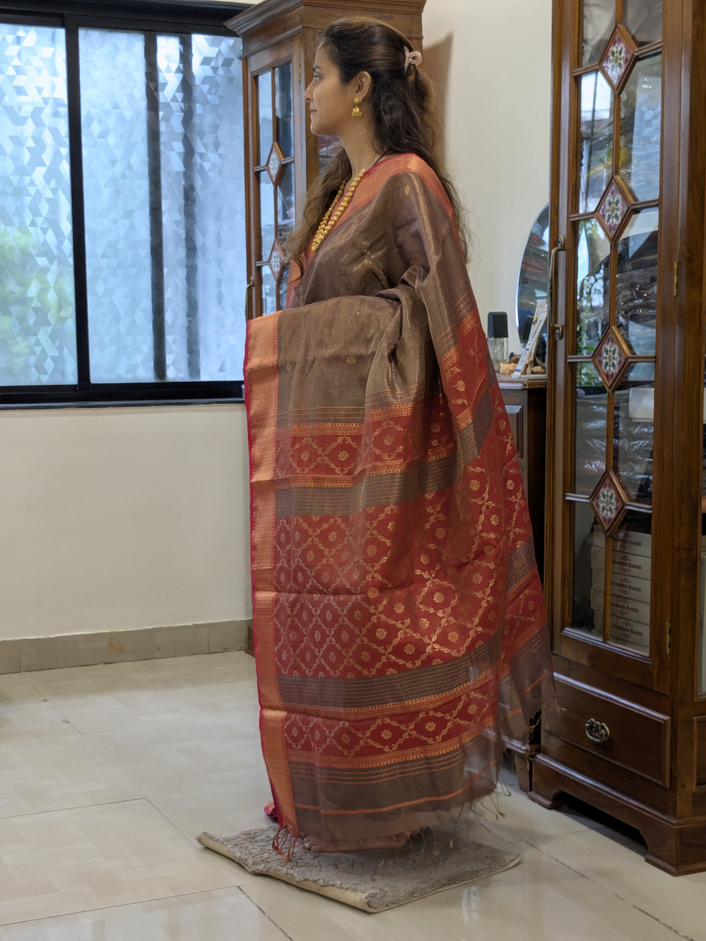 Side view highlighting soft drape, floral motifs, and handloom craftsmanship.