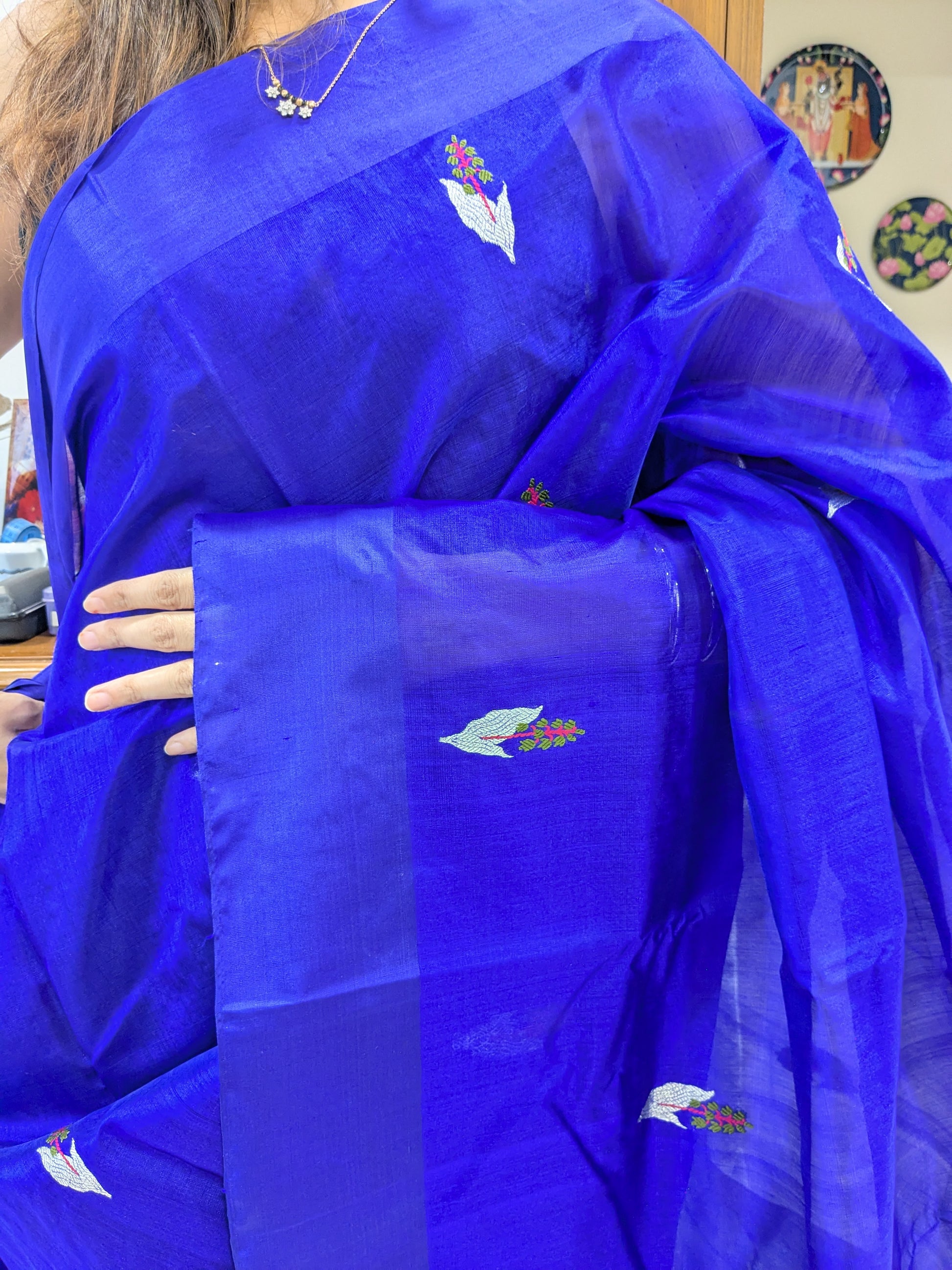 Close-up of violet pure Chanderi silk saree with floral motifs, medium border