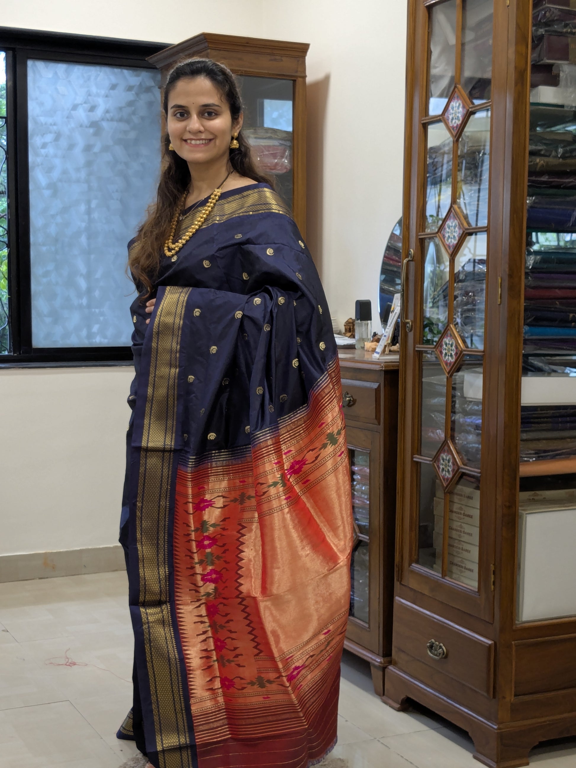 Full front view of elegant bridal Paithani in deep grey with lustrous handloom finish.