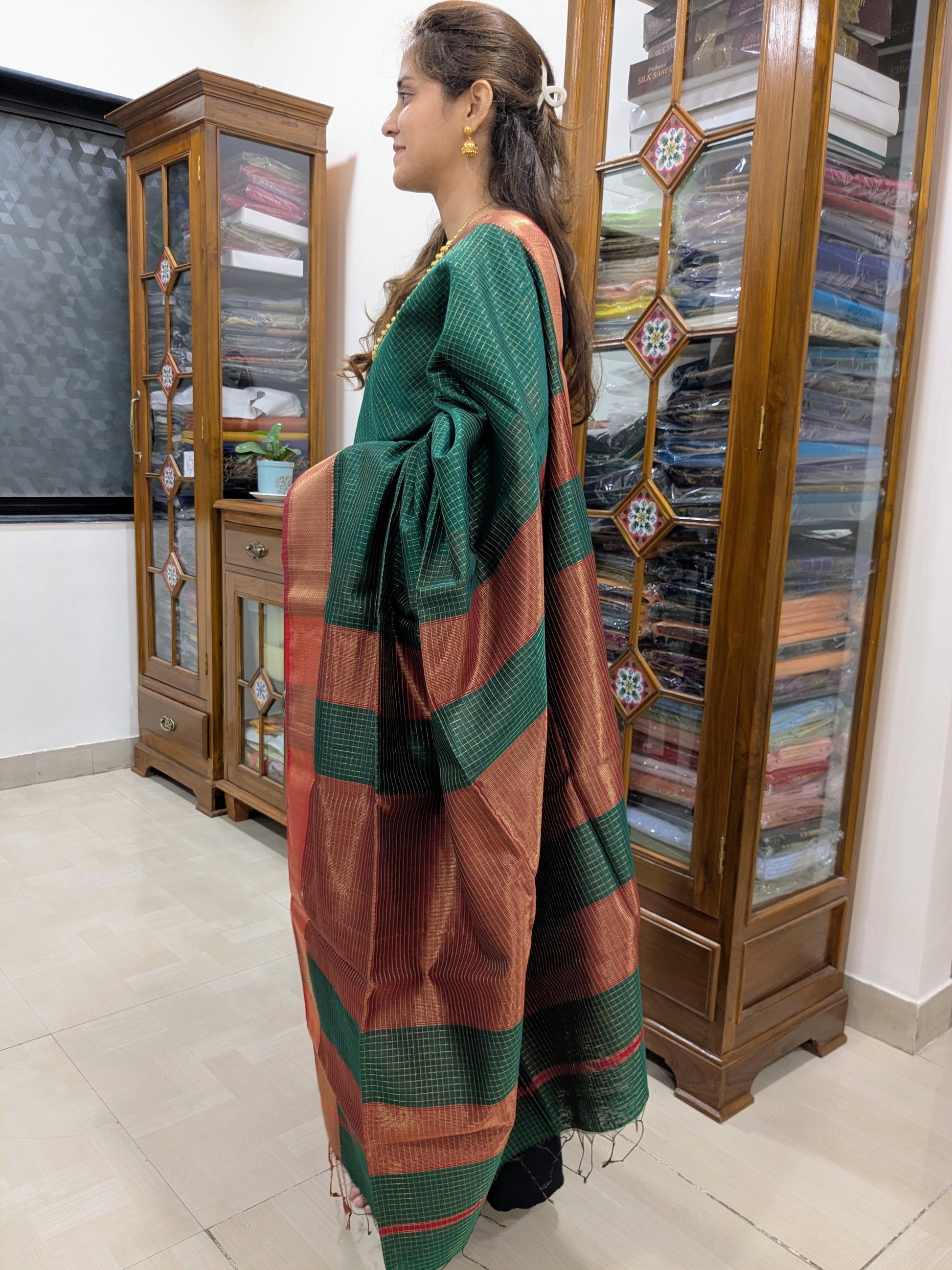 Side view of black Paithani saree showing fluid drape, vibrant detailing, and traditional handwoven craftsmanship.