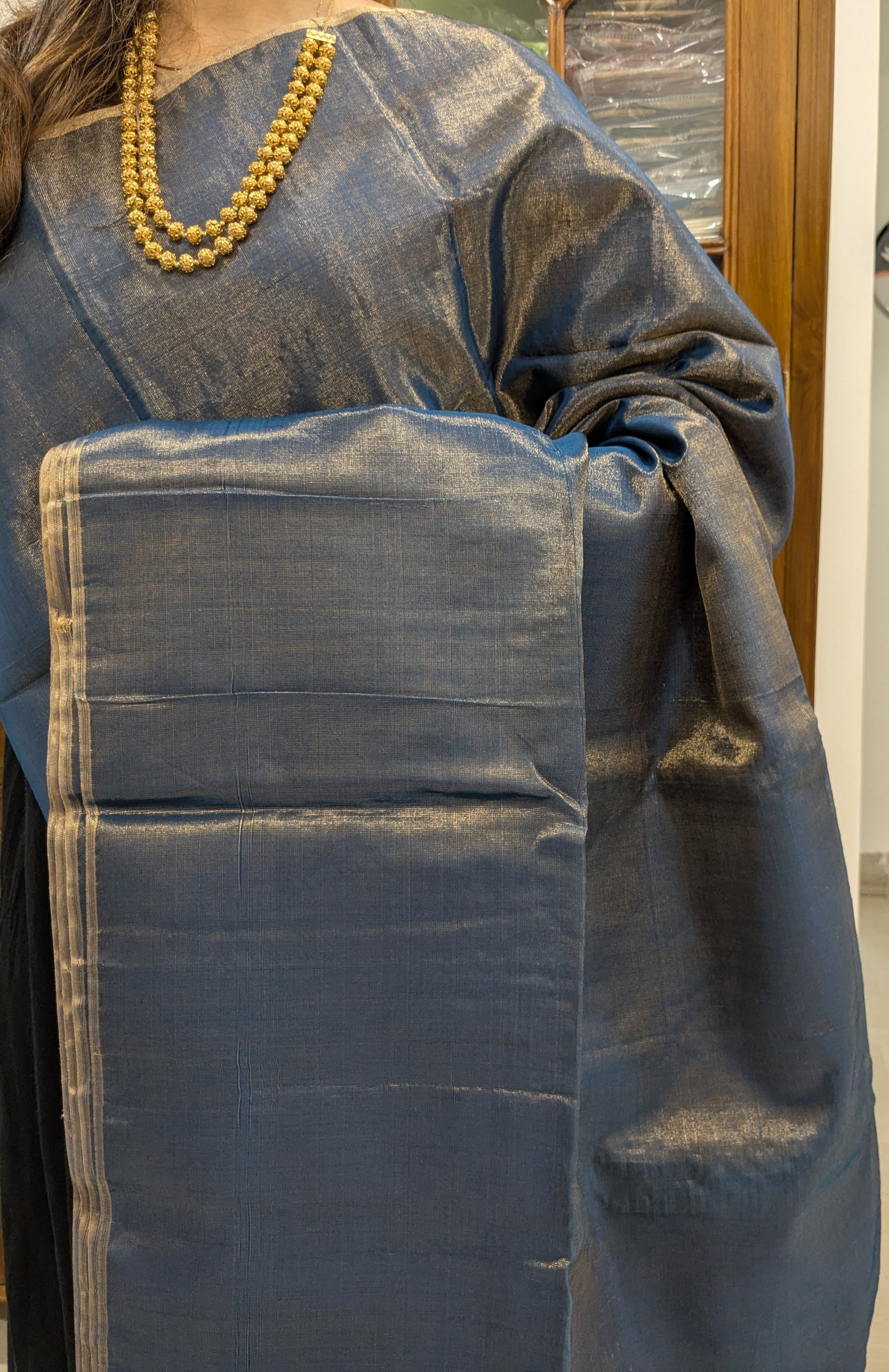 Close-up of Morpankhi Maheshwari saree in tissue-cotton with handwoven plain weave and soft finish.