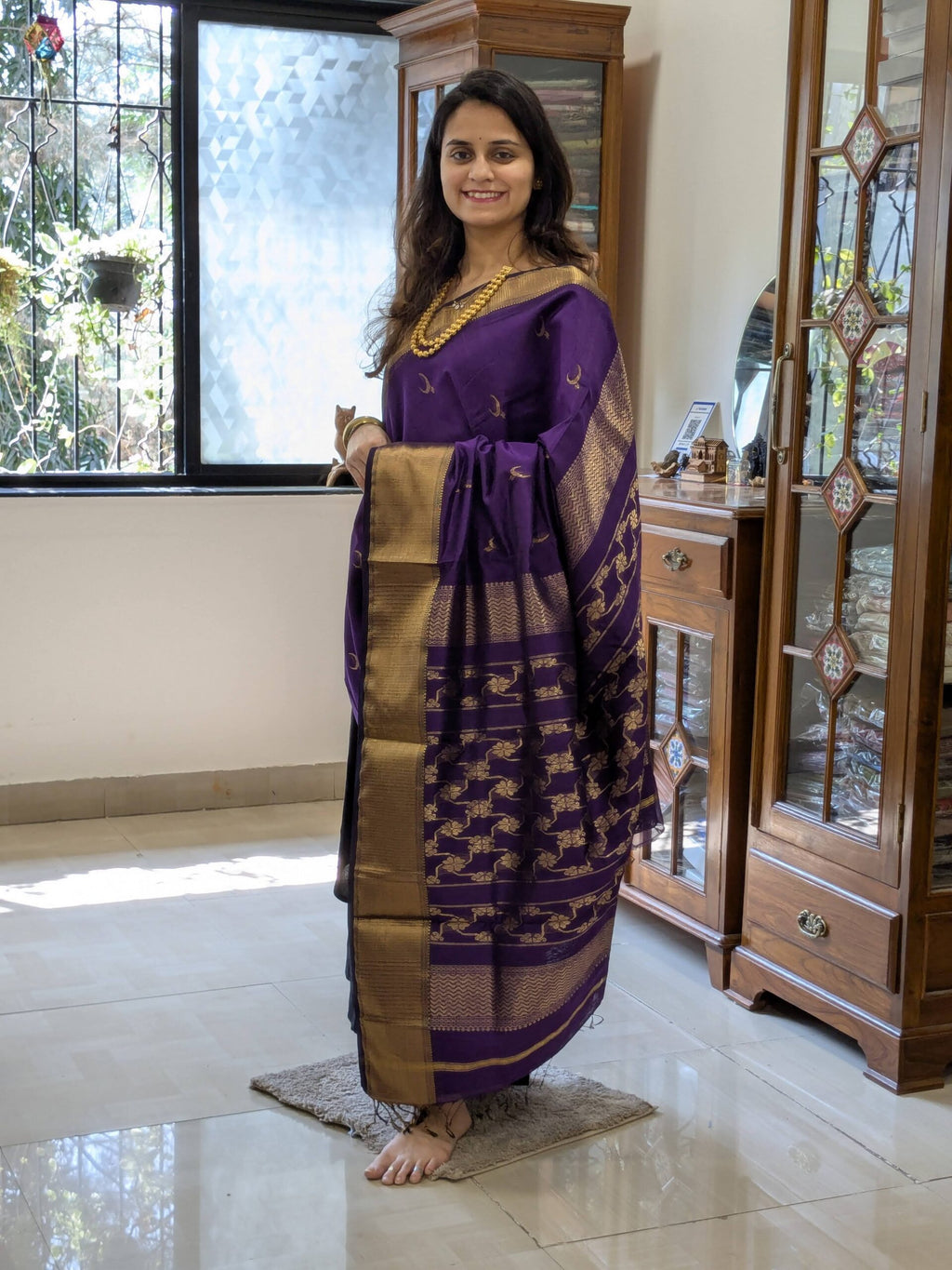 Full front view of festive purple silk-cotton Maheshwari saree showcasing traditional motifs and rich handwoven texture