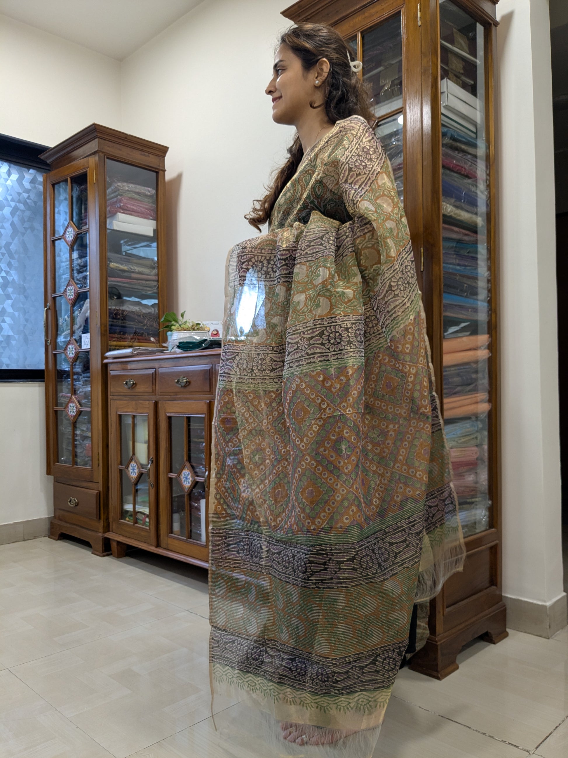 Side view capturing the saree’s soft texture and subtle translucence, perfect for office or party wear.