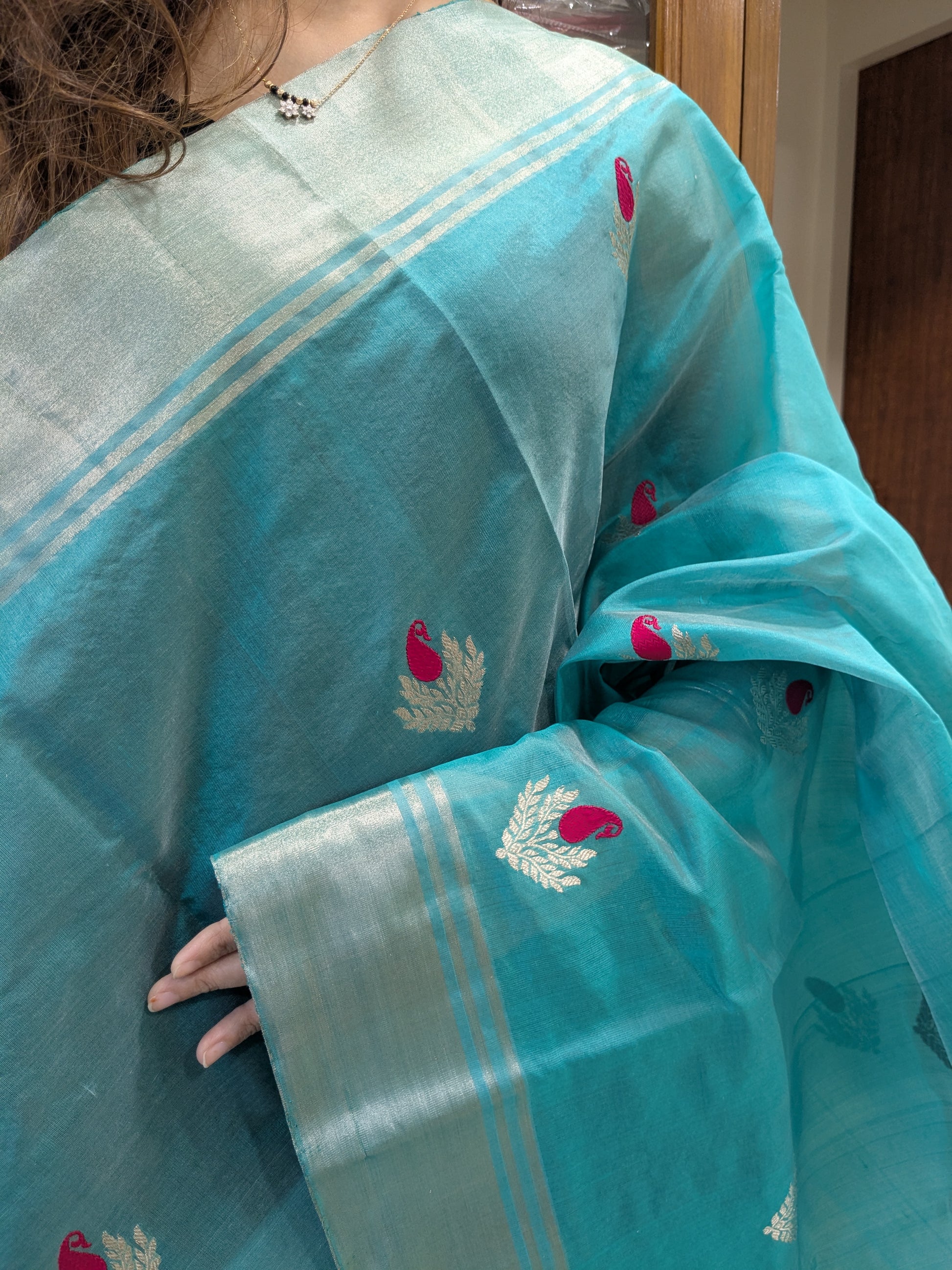 Close-up of rama green pure Chanderi silk saree with floral motifs, medium border