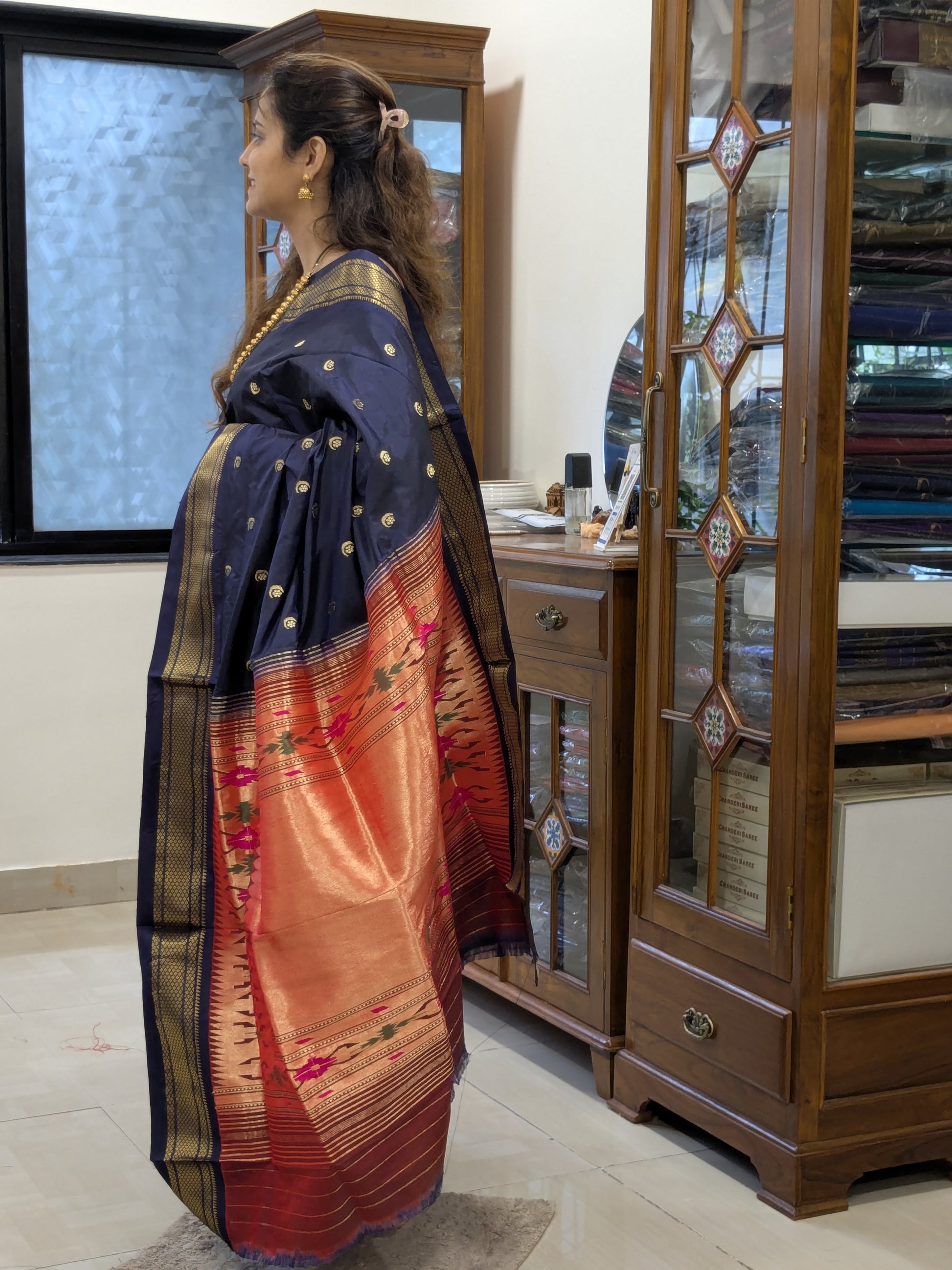 Side view showing graceful drape and refined sheen of silk with delicate butti motifs.