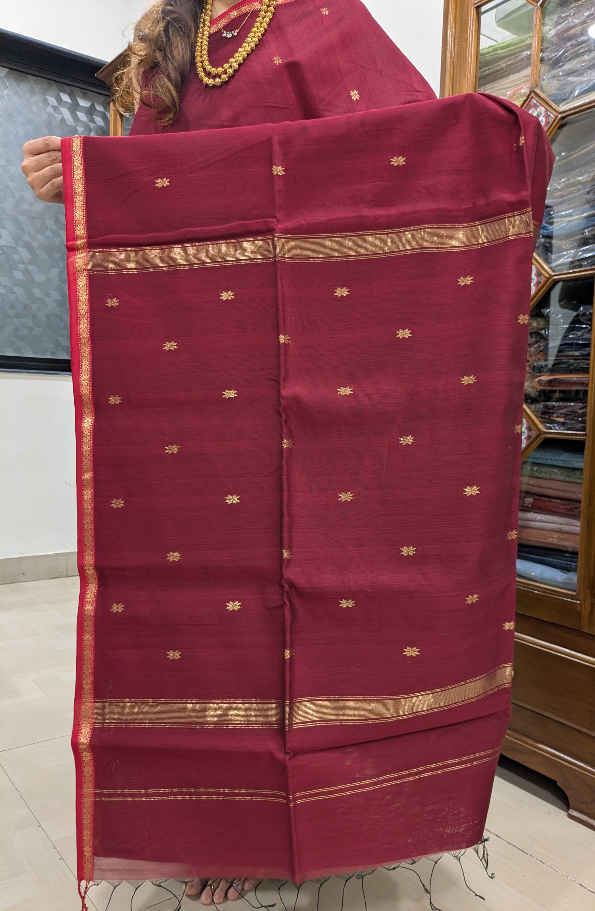Detailed pallu image with star butti work reflecting traditional craftsmanship.