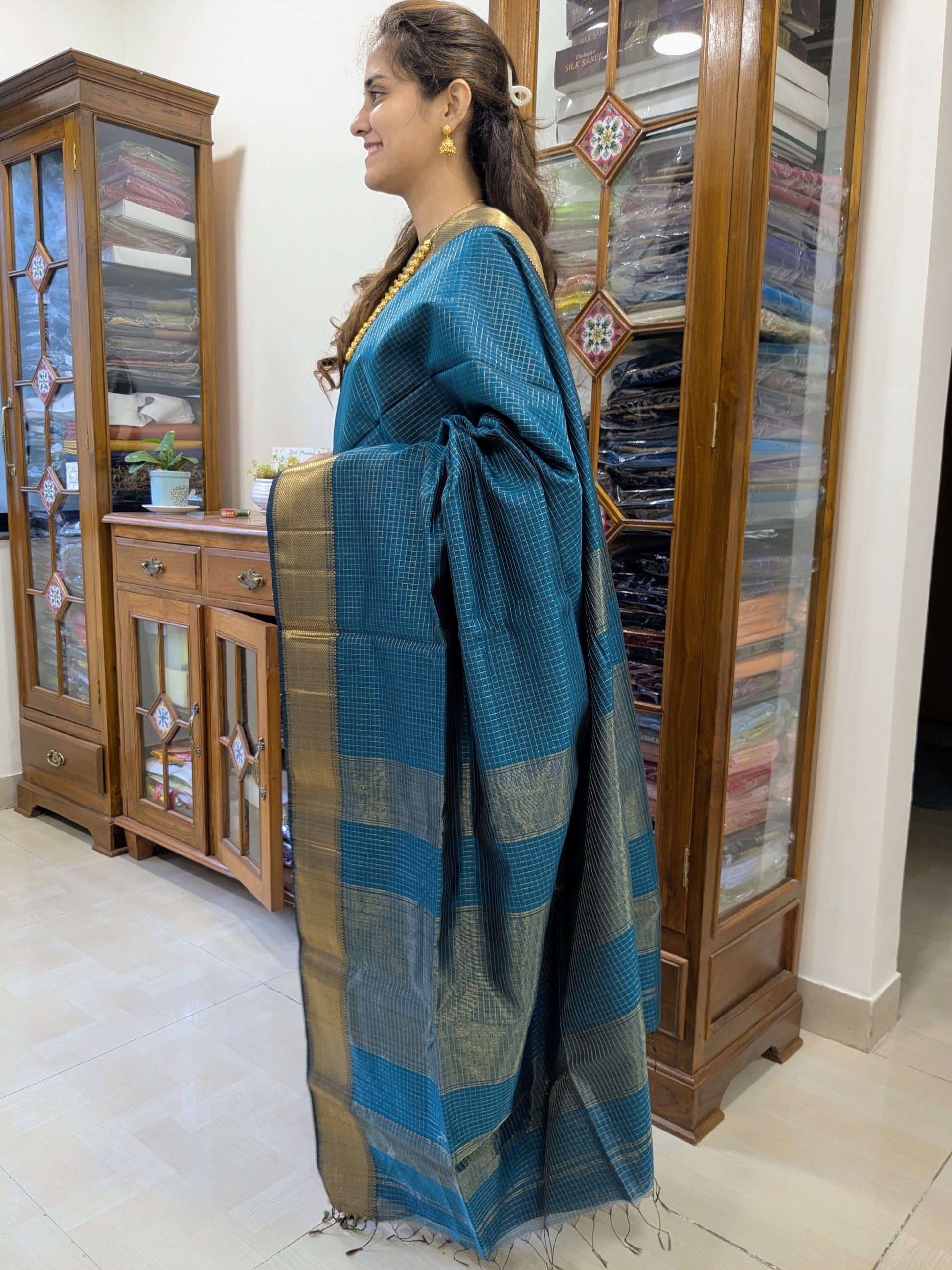 Side view showing the soft silk-cotton texture and intricate zari-checked weave from Central India.
