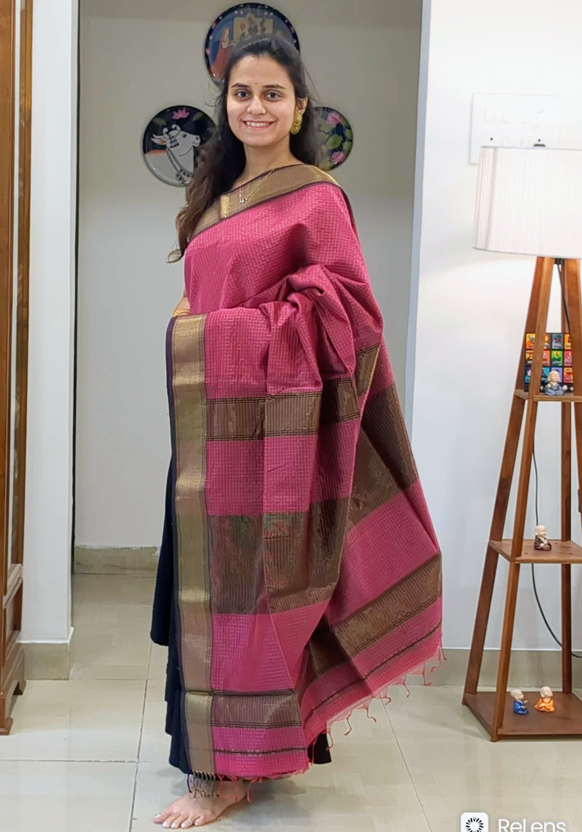 Full front view of festive onion pink handloom Maheshwari saree featuring all-over zari check pattern and elegant shine.