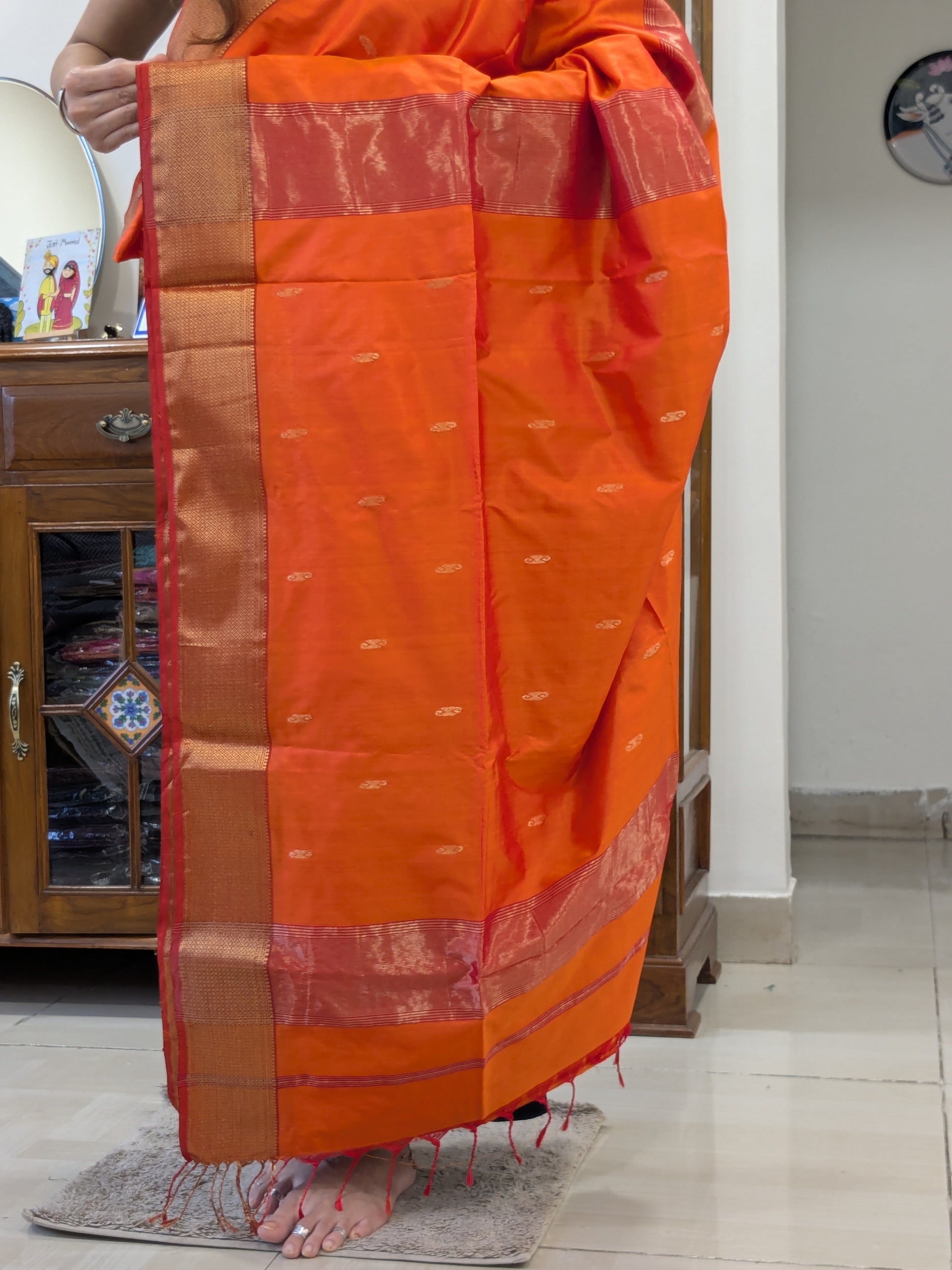 Detailed pallu showcasing butticar weave and rich jaali craftsmanship.