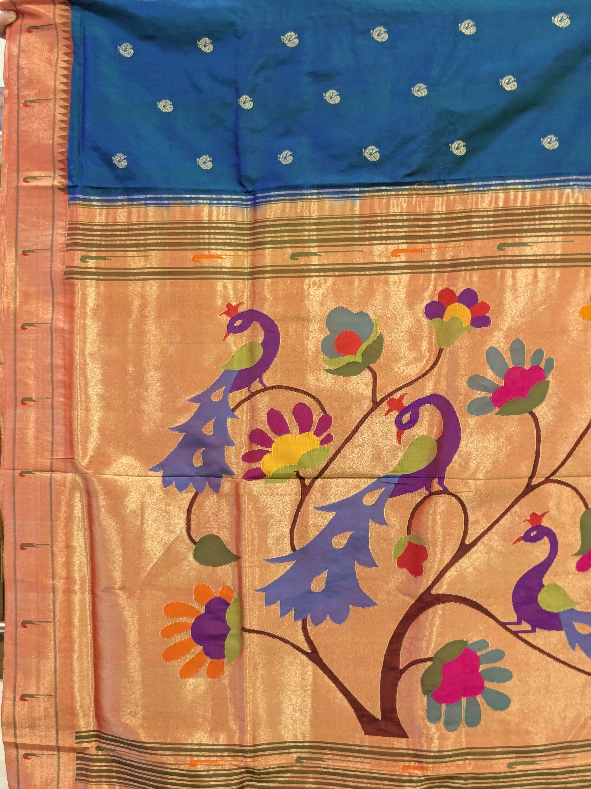 Detailed fancy peacock pallu showcasing rich traditional artistry.