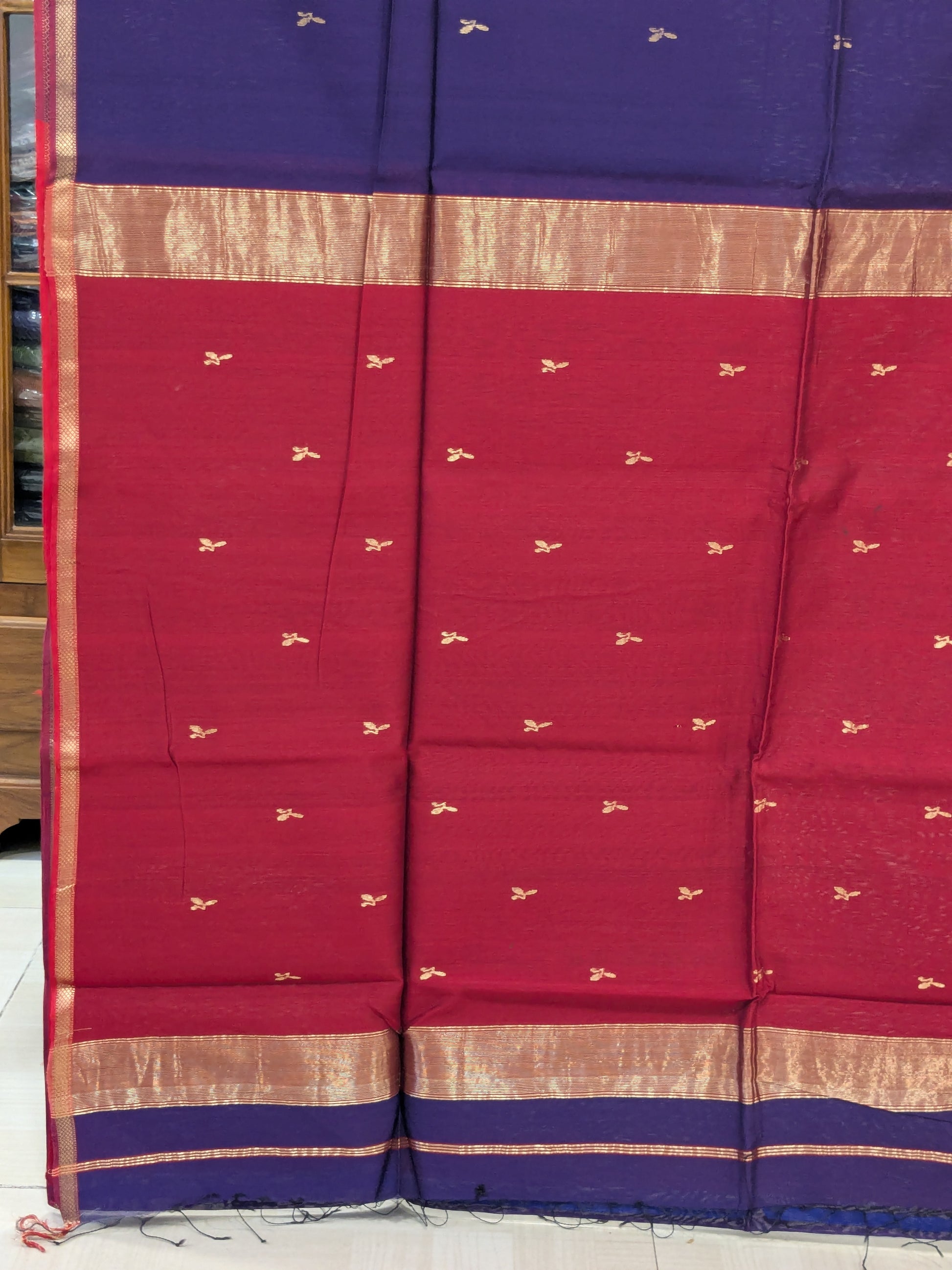 Blue and Red saree with gold pattern.