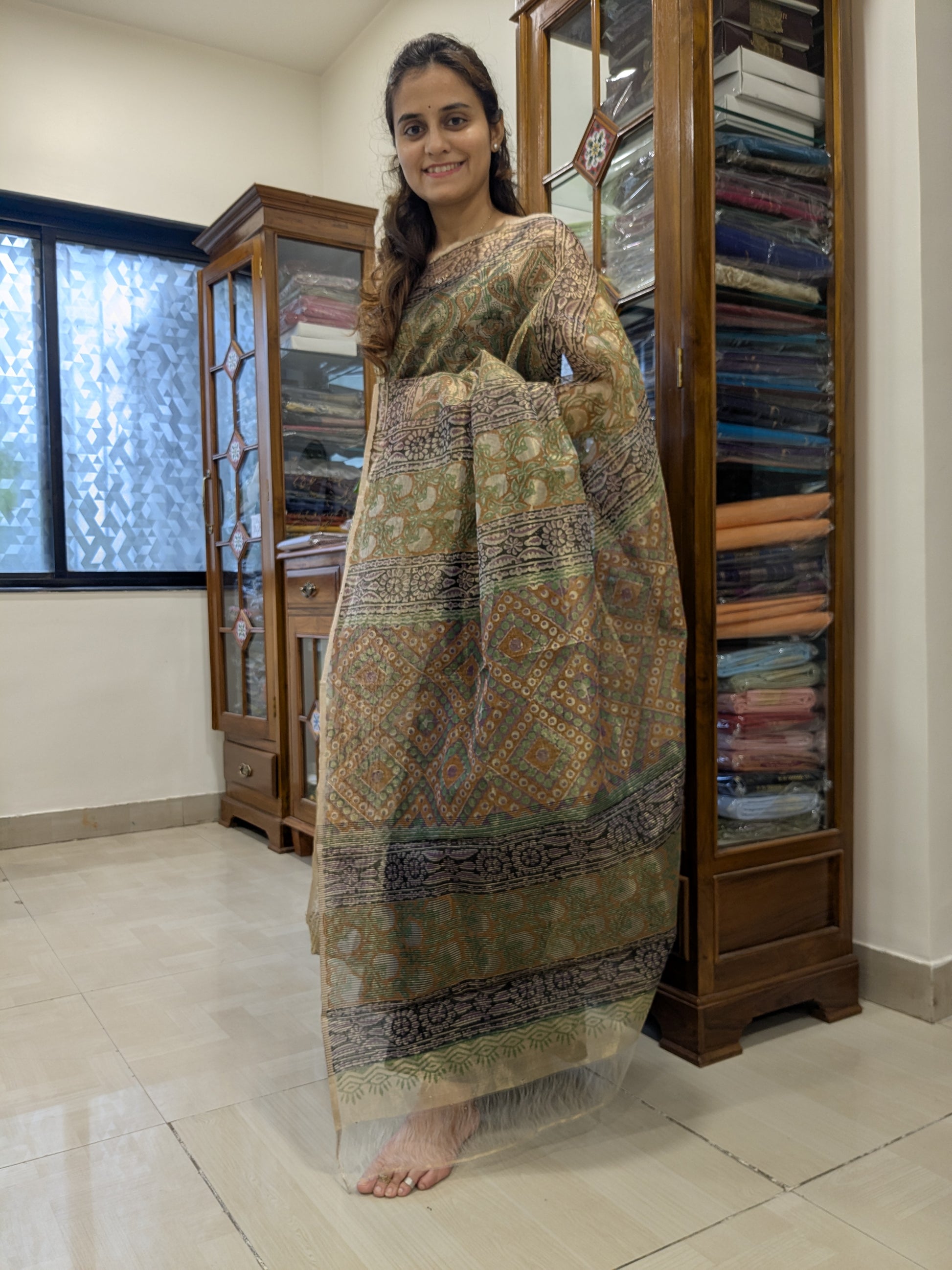 Front view highlighting the rich golden sheen and lightweight drape of 100% pure Chanderi silk.