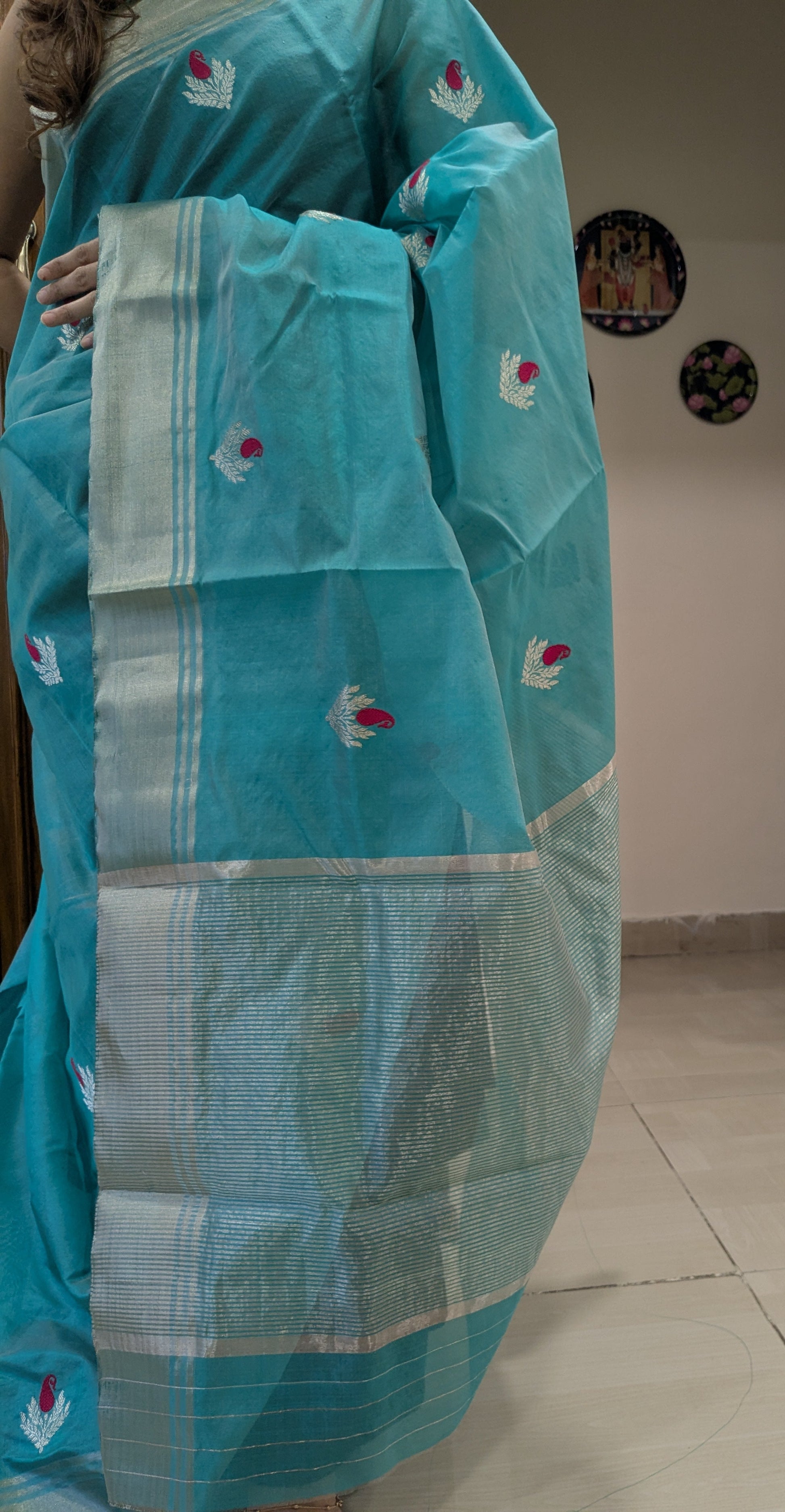 Detailed image of heavy pallu with ornate floral weaving and traditional detailing.