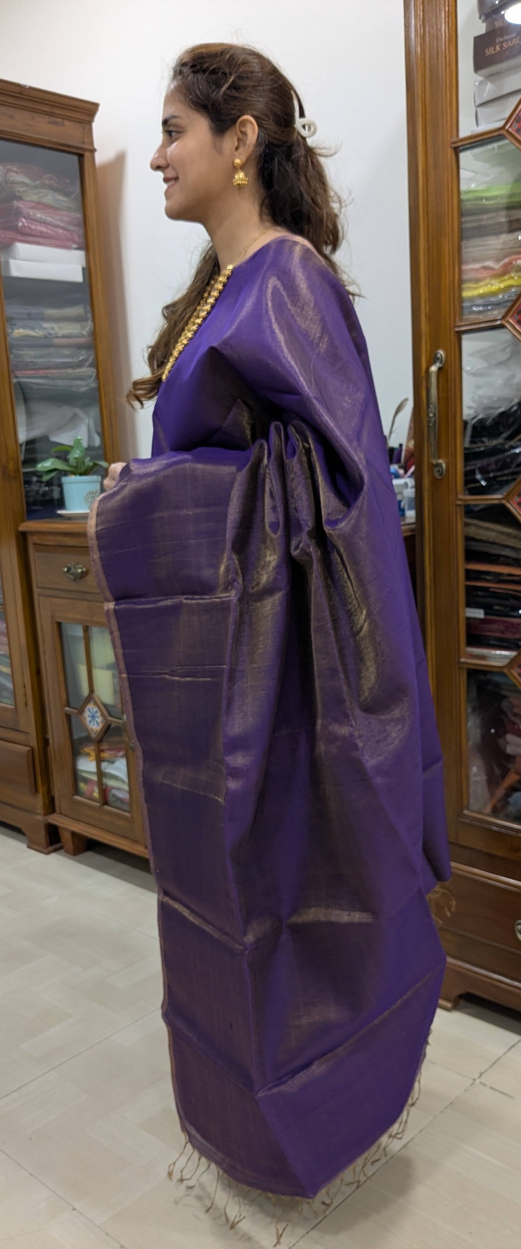 Side view revealing soft fall and lightness of the handwoven tissue-cotton fabric.