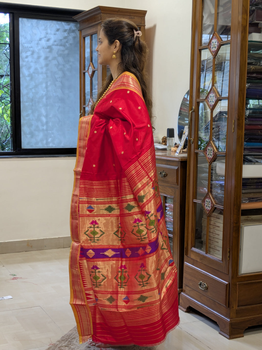 Side view showcasing graceful drape and lustrous silk texture.
