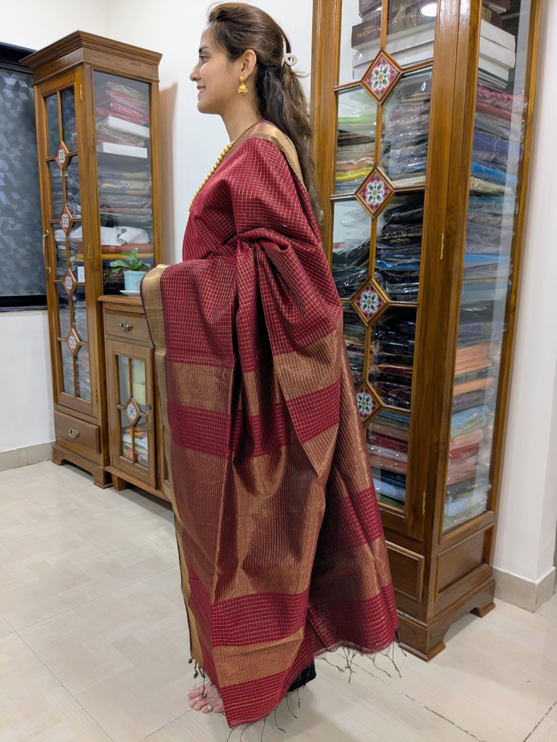 Side view highlighting soft silk-cotton drape and shimmering zari pattern from Central India.