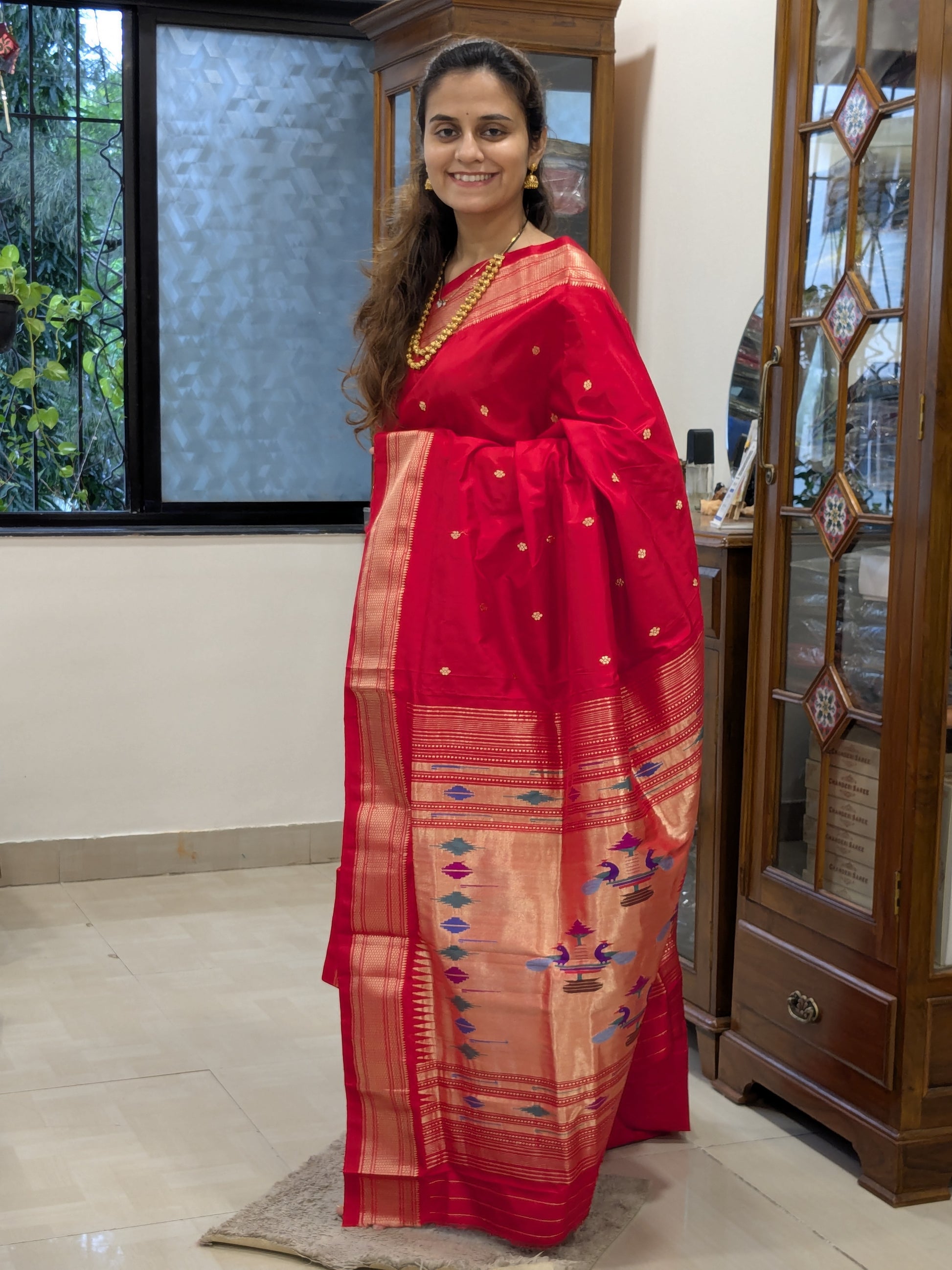 Full front view showcasing the luxurious Narali border and rich handloom weave.