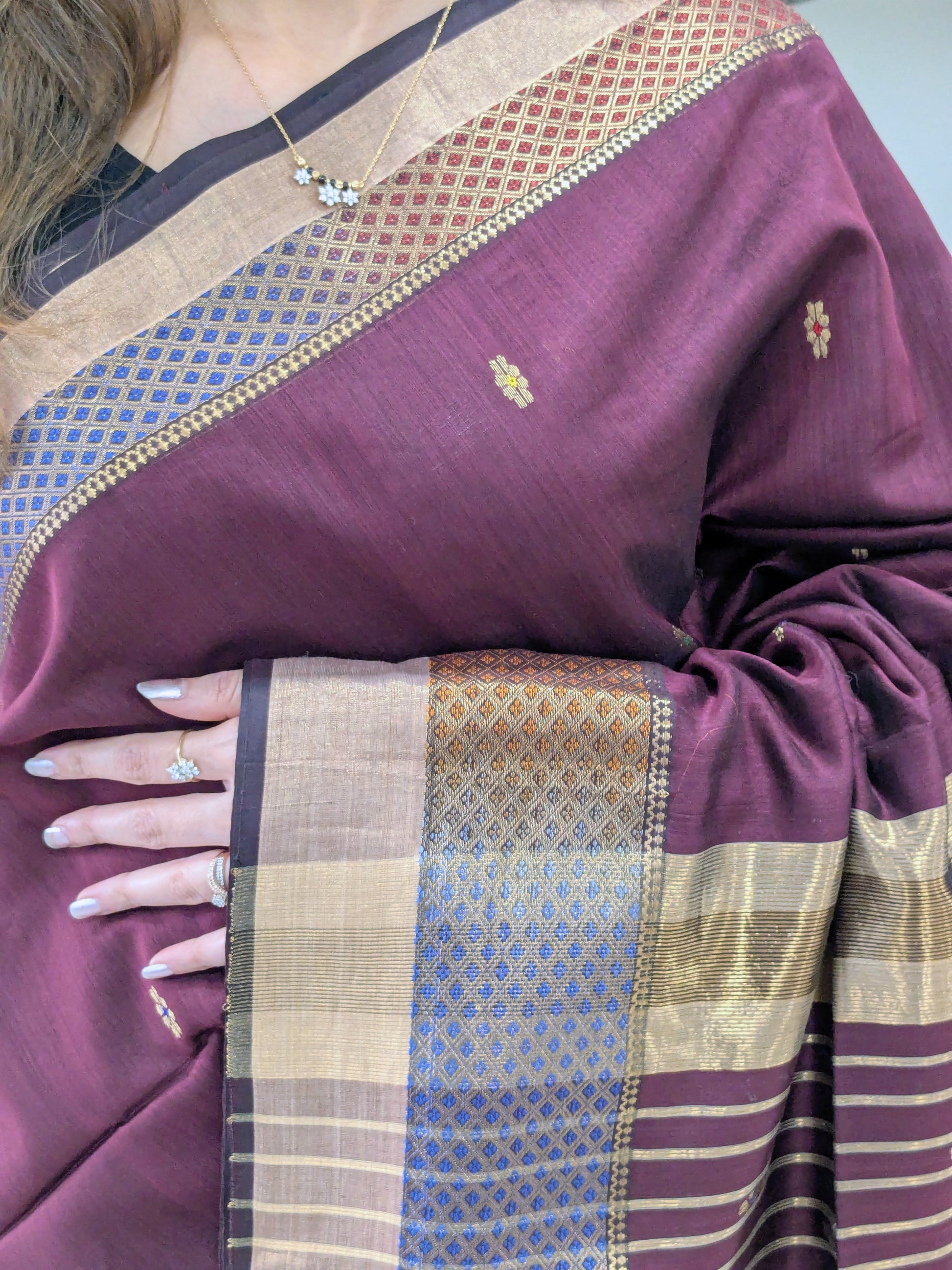 Purple saree with a patterned border