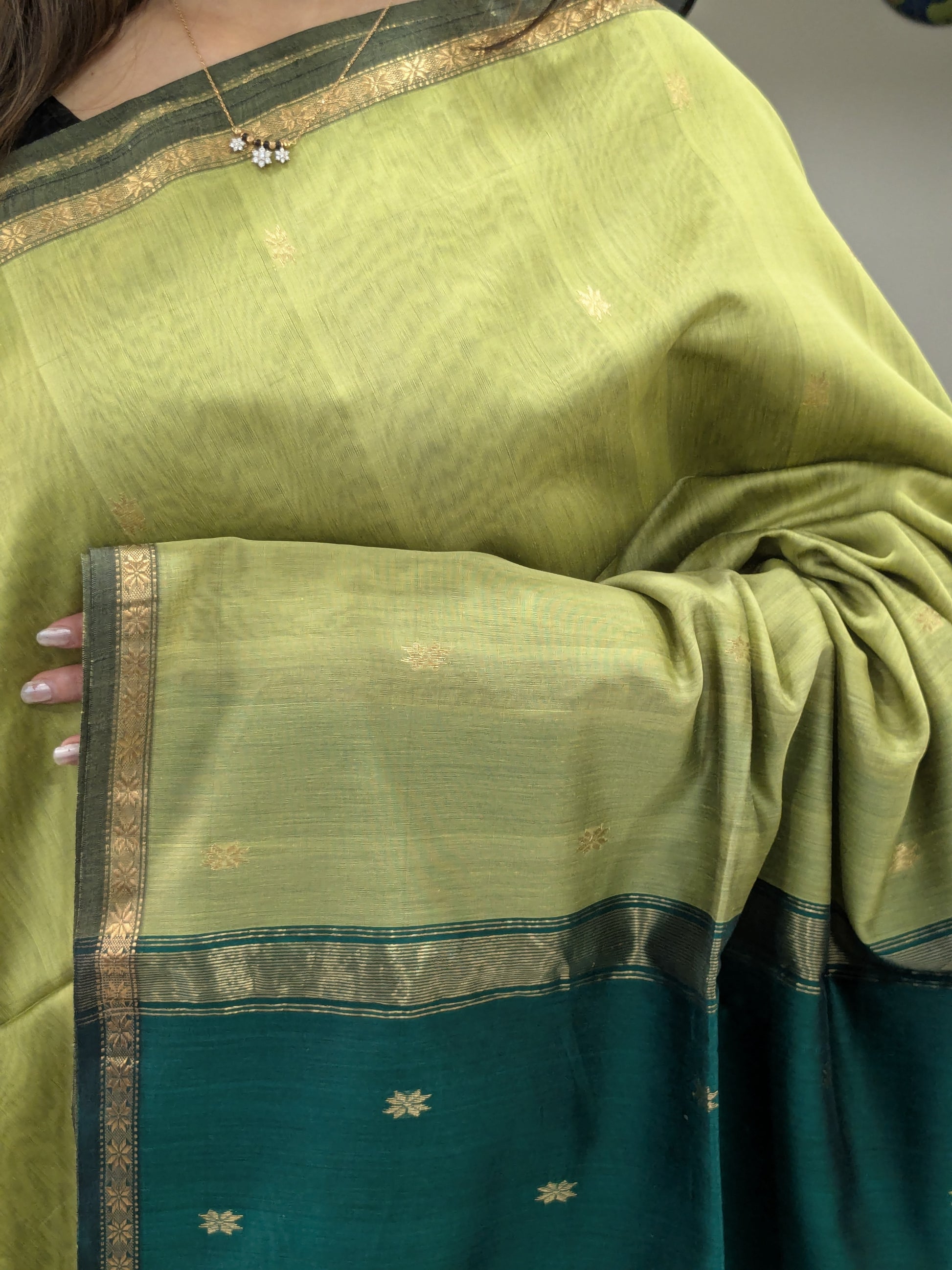 Green saree with gold border