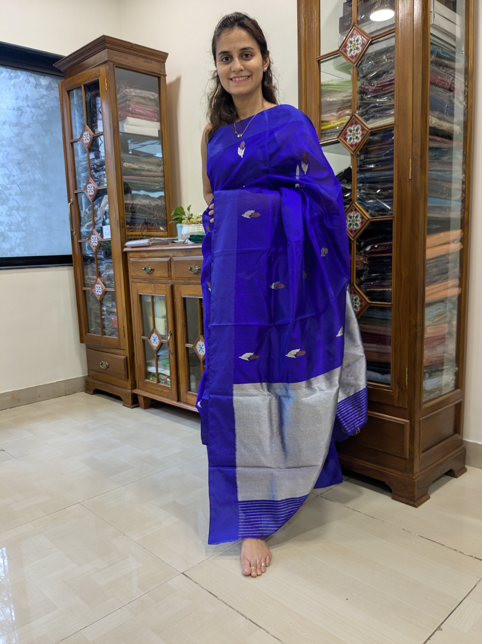 Full front view of festive violet handloom Chanderi saree featuring elegant flower designs and lustrous texture. 
