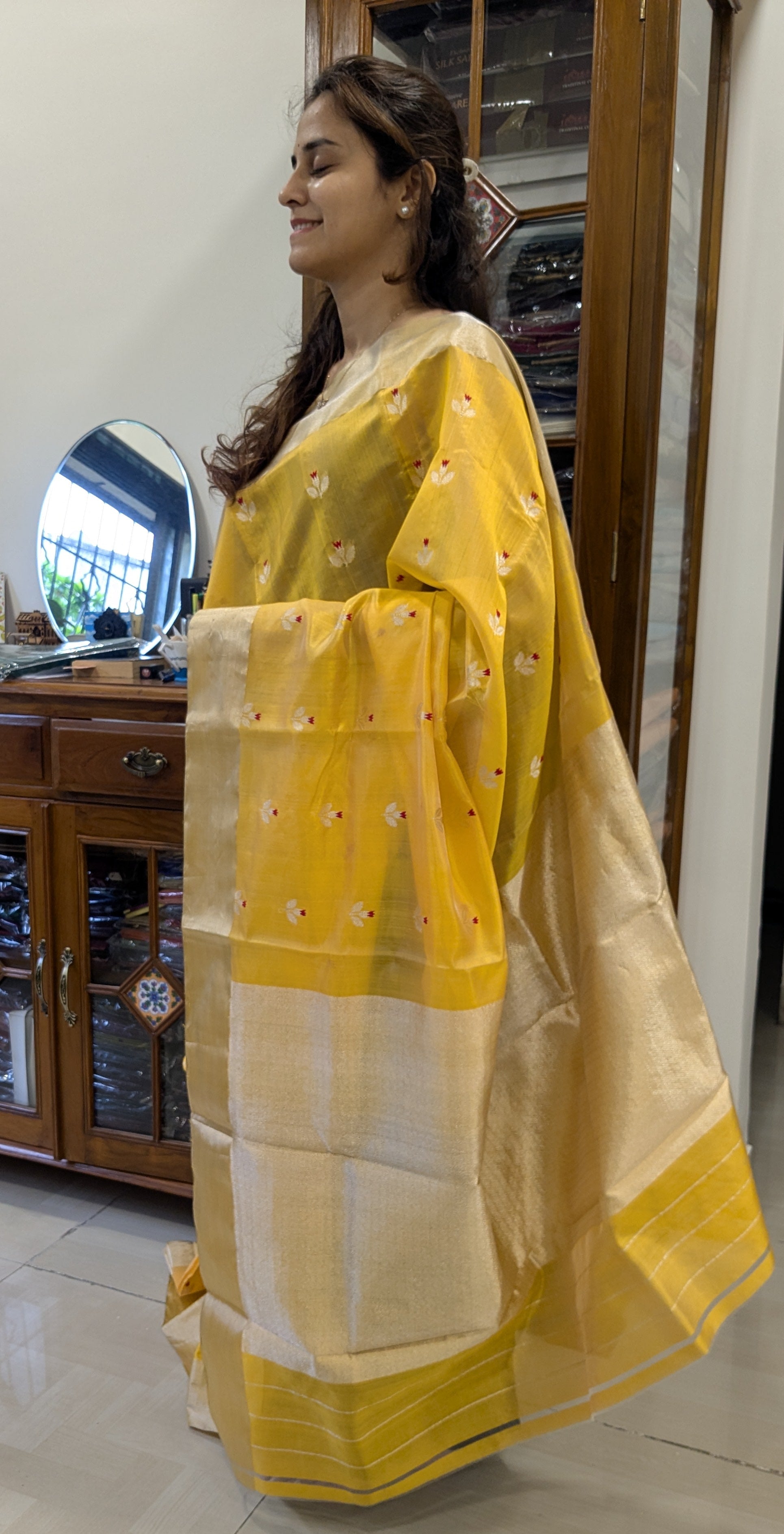 Side view capturing the soft fall and airy feel of this festive saree.