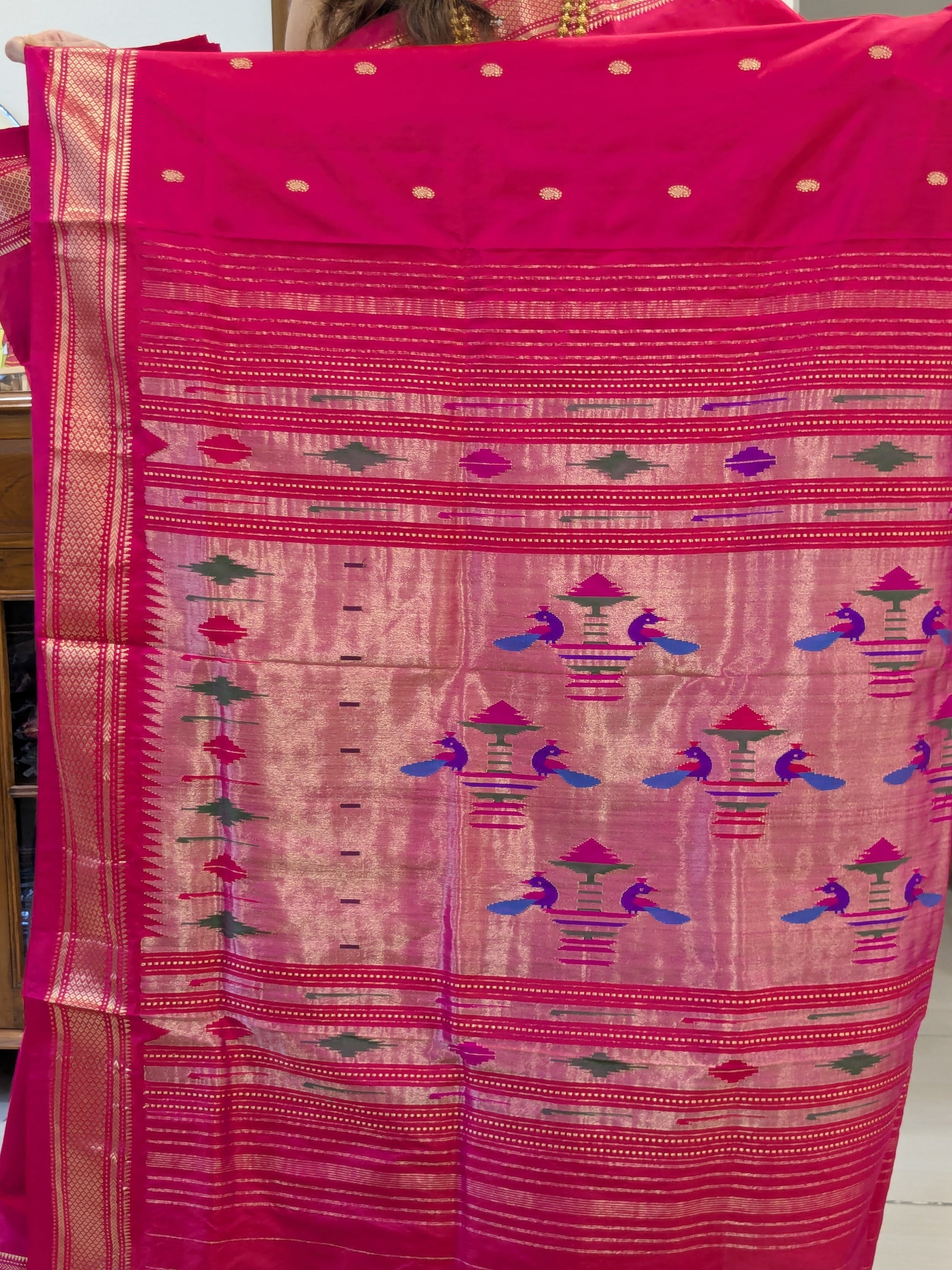 Detail of the peacock design on the pallu – a timeless hallmark of Paithani elegance.