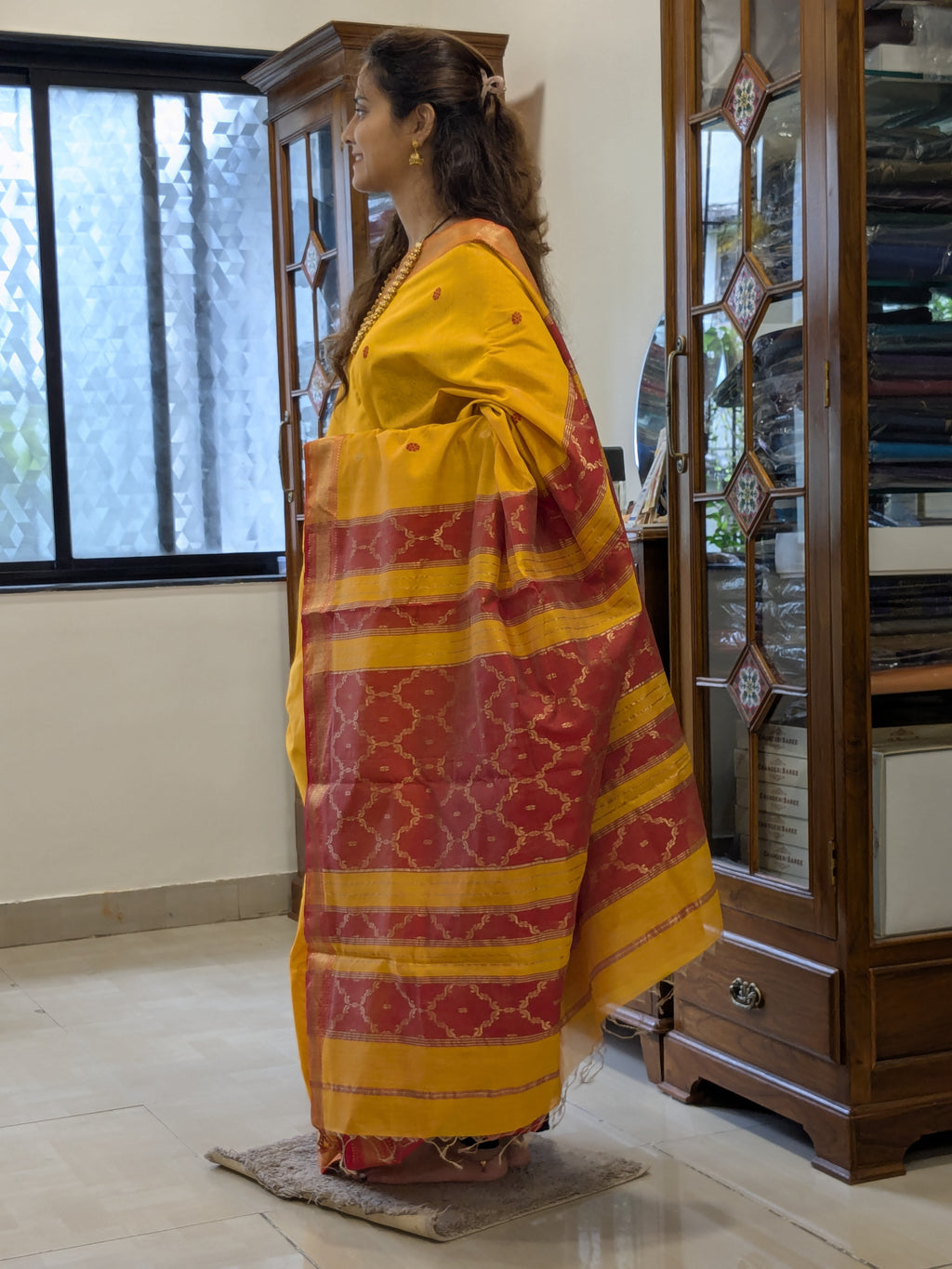 Side view showcasing lightweight drape and handloom-woven floral butti texture.