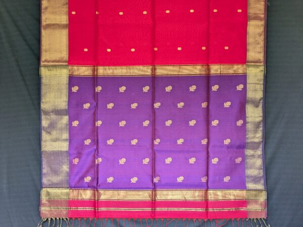 Detailed image of buttidar pallu in deep purple with intricate floral motifs and shimmering threadwork.