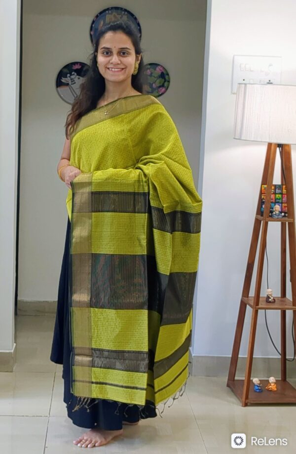 Full front view of festive mehendi green handloom Maheshwari saree featuring golden zari checks and elegant texture.