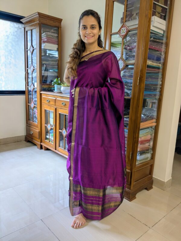 Full front view of vibrant magenta handloom Maheshwari saree featuring classic check pattern and elegant texture.