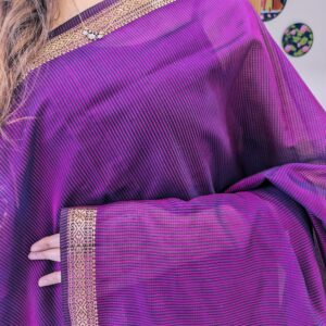 Close-up of magenta Maheshwari saree with small checks
