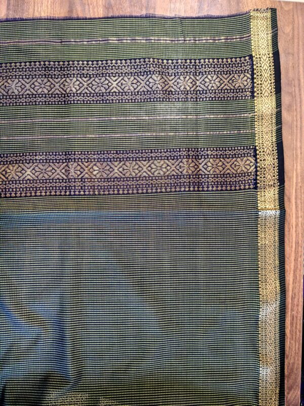 Detailed image of vintage pallu in olive green with fine handloom craftsmanship.