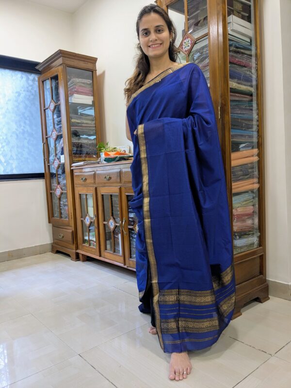 Full front view of royal blue handloom Maheshwari saree featuring classic check pattern and traditional finish.