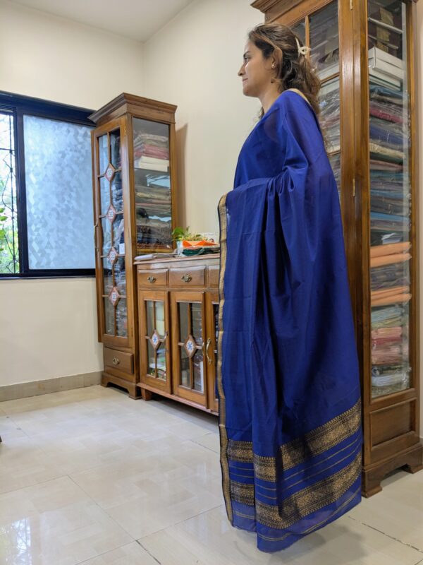 Side view of lightweight royal blue saree showing elegant drape, fine texture, and timeless weave.