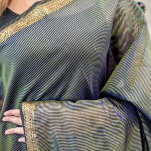 Close-up of olive green Maheshwari saree with small checks, zari border
