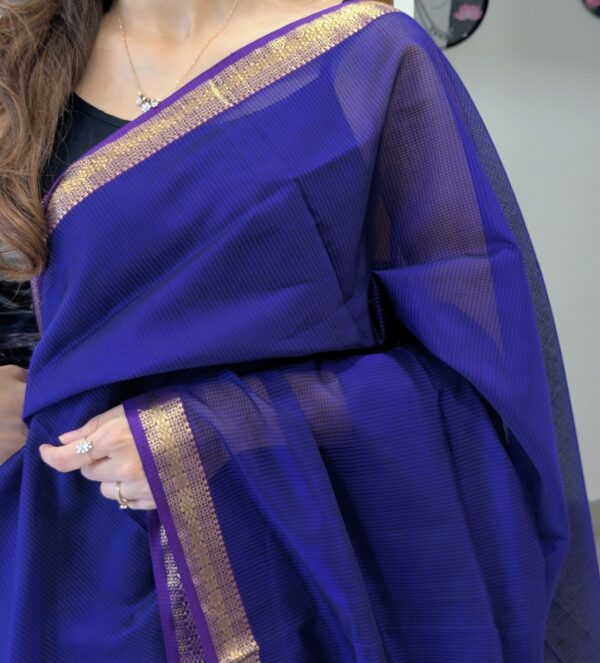 Close-up of purple Maheshwari saree with small checks