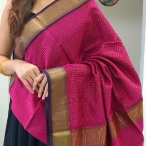 Close-up of dark rani pink Maheshwari silk-cotton saree with zari checks, medium border
