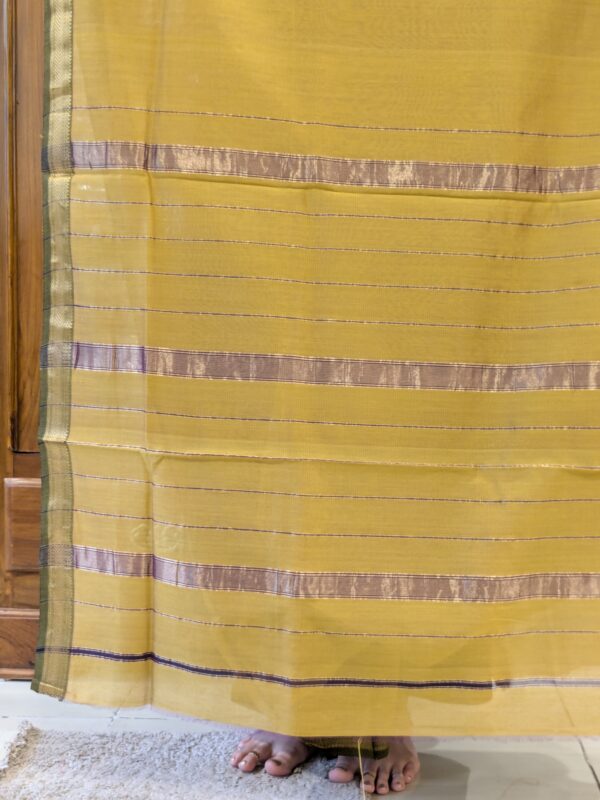 Image of zari-lined pallu with fine golden stripes and refined handloom finish.